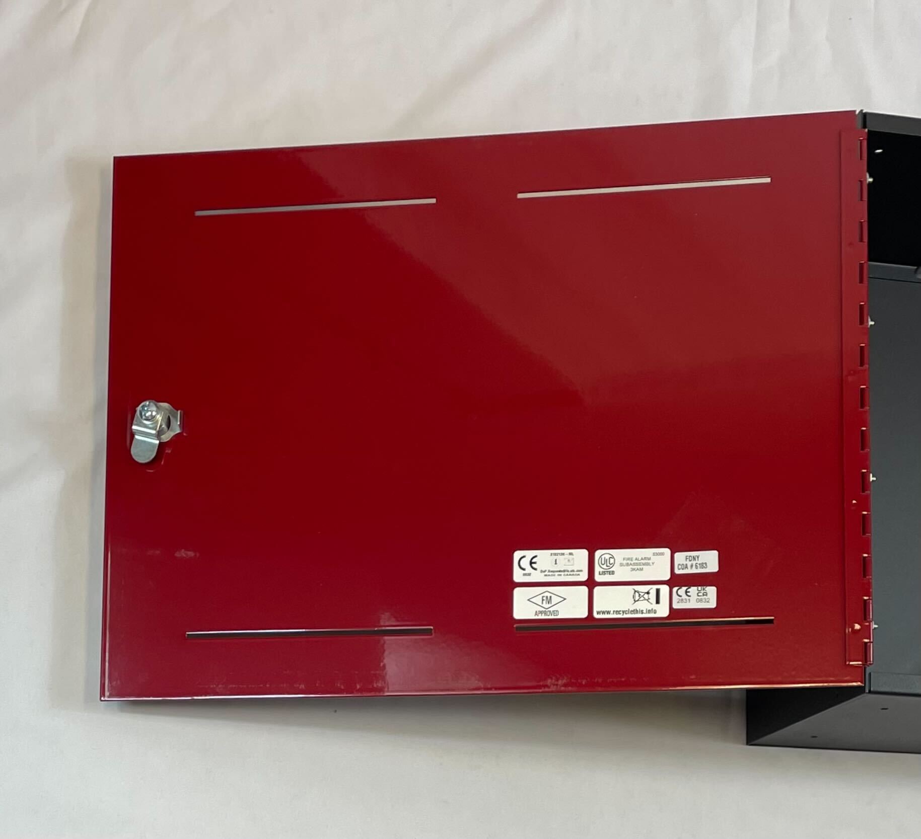 Edwards BC-1R backbox by Edwards, shown in a clean, white metal enclosure with mounting brackets for HVAC or electrical systems.
