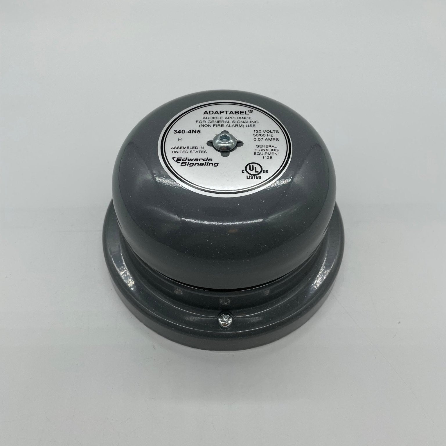 Edwards 340-4N5 bell, a brass fire alarm bell with a metal mounting bracket, designed for commercial fire safety systems.