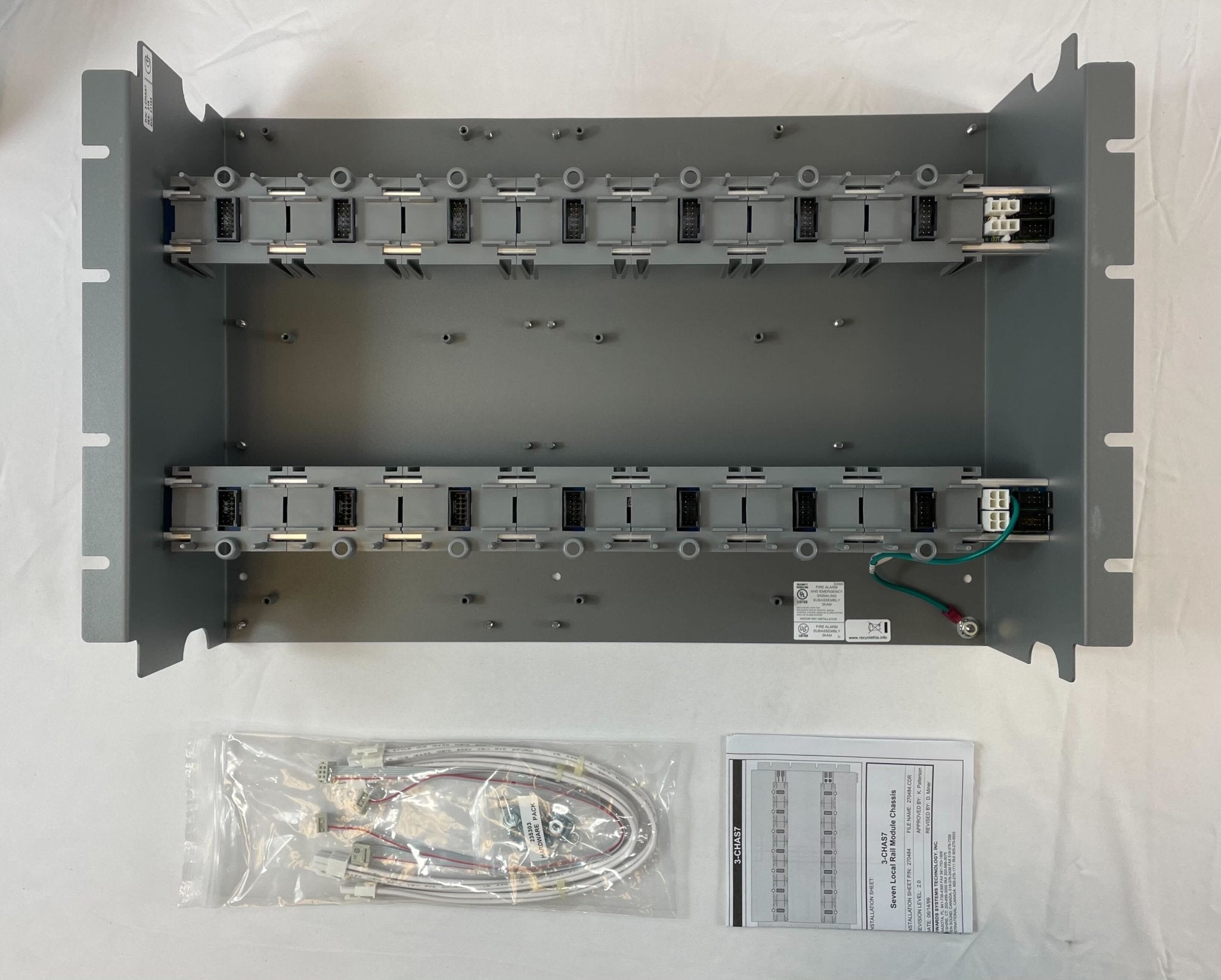 Edwards 3-CHAS7 fire alarm system sensor with ULC certification, mounted on a wall in a building safety setting.