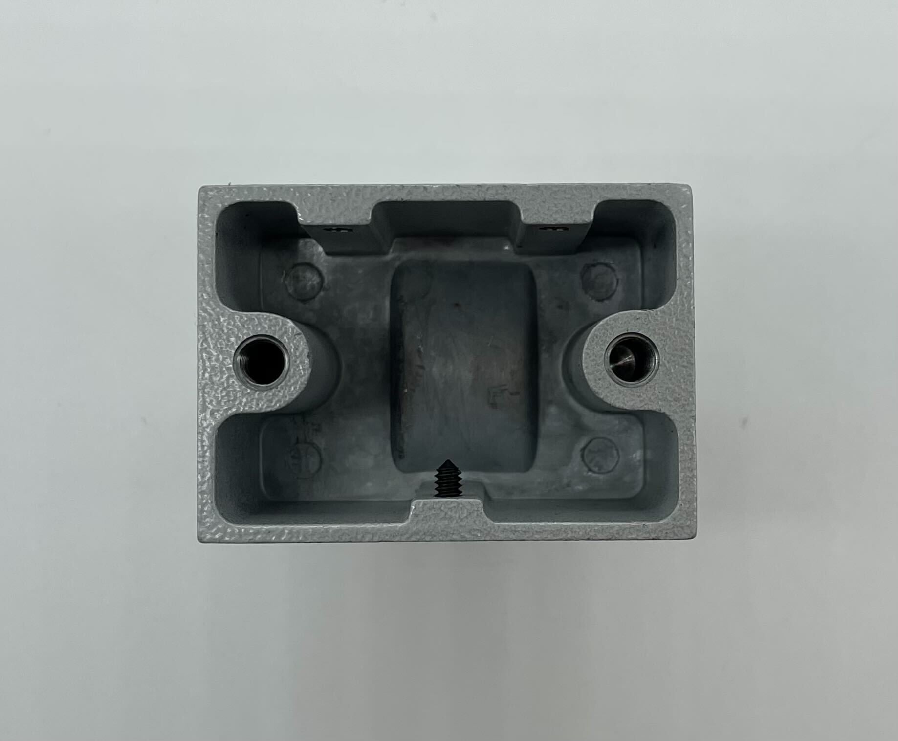 Edwards CS2598-5 door holder installed on a door, showing a sturdy metal device designed to keep doors open.