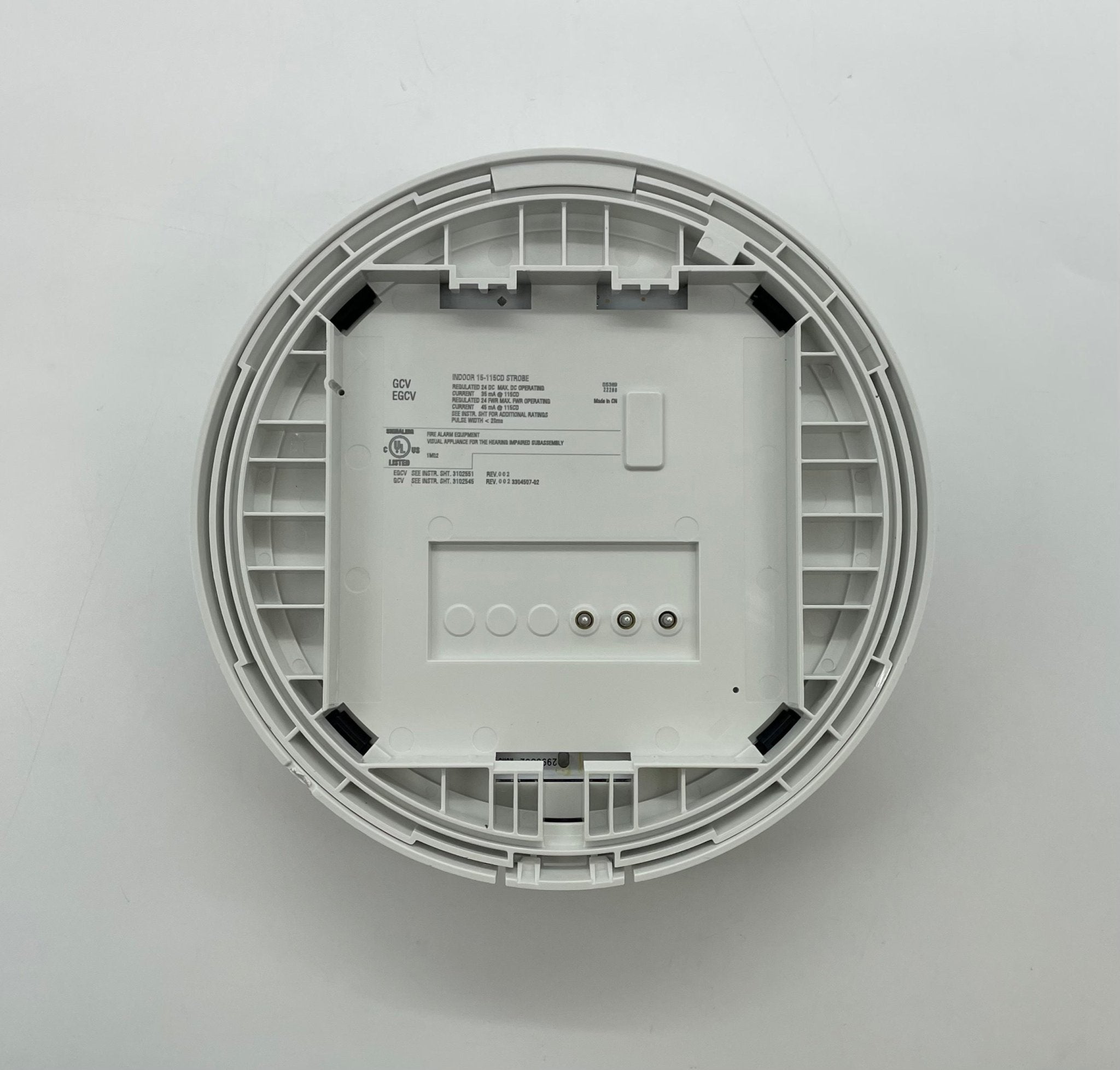 Edwards EGCVWF strobe light mounted on a wall, with visible wiring and control panel for industrial safety signaling.