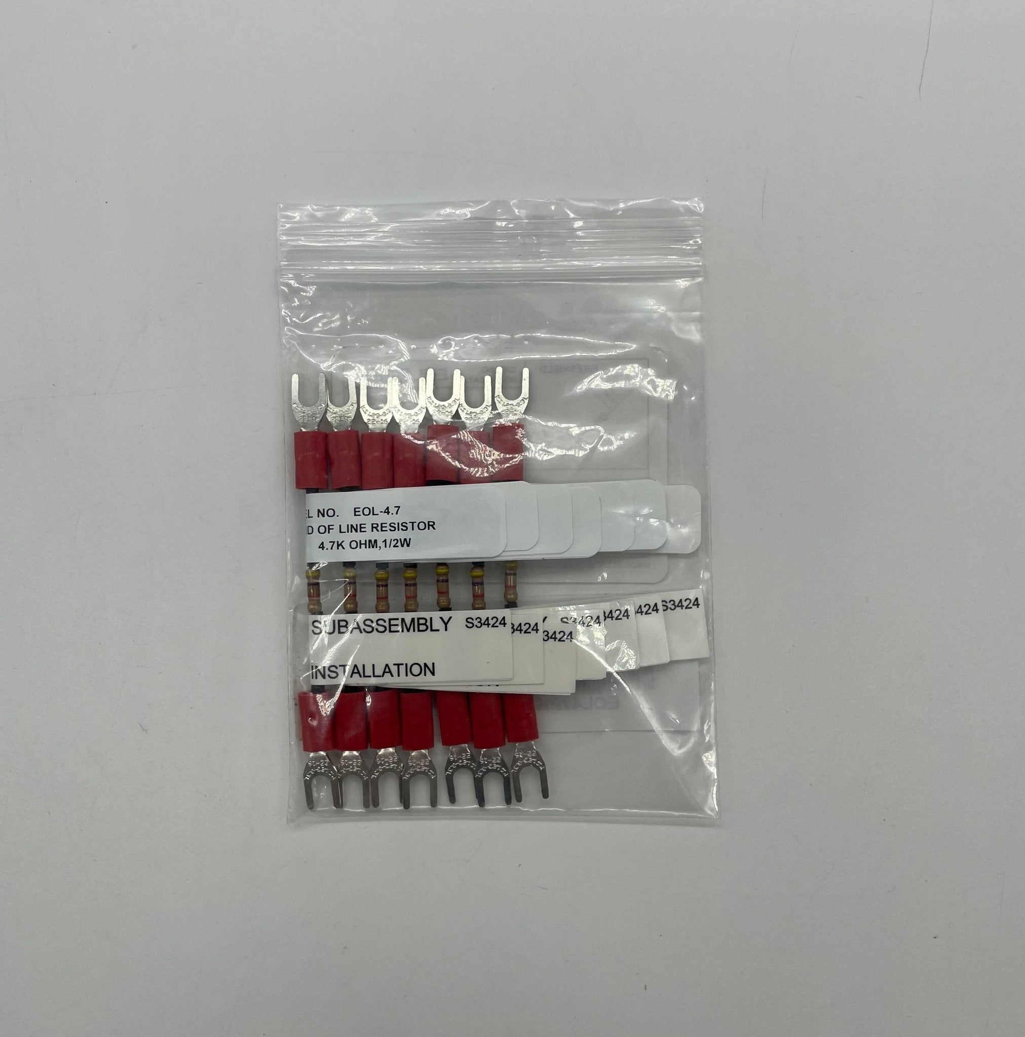 Edwards EOL47PK7 EOL resistor showing color-coded bands and metal leads for electronic circuit applications.