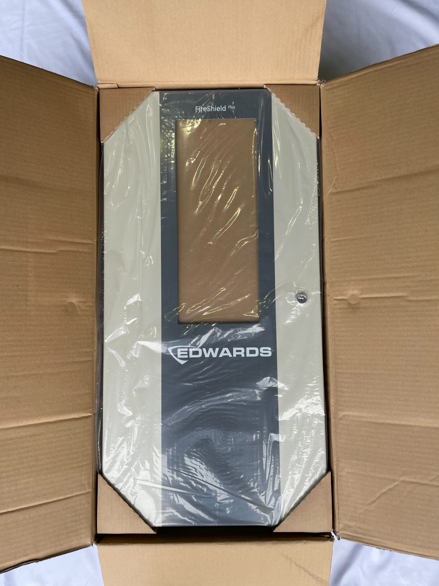 Edwards FSP1004GD control panel with multiple switches and indicator lights, mounted on a metal panel for industrial fire safety systems.