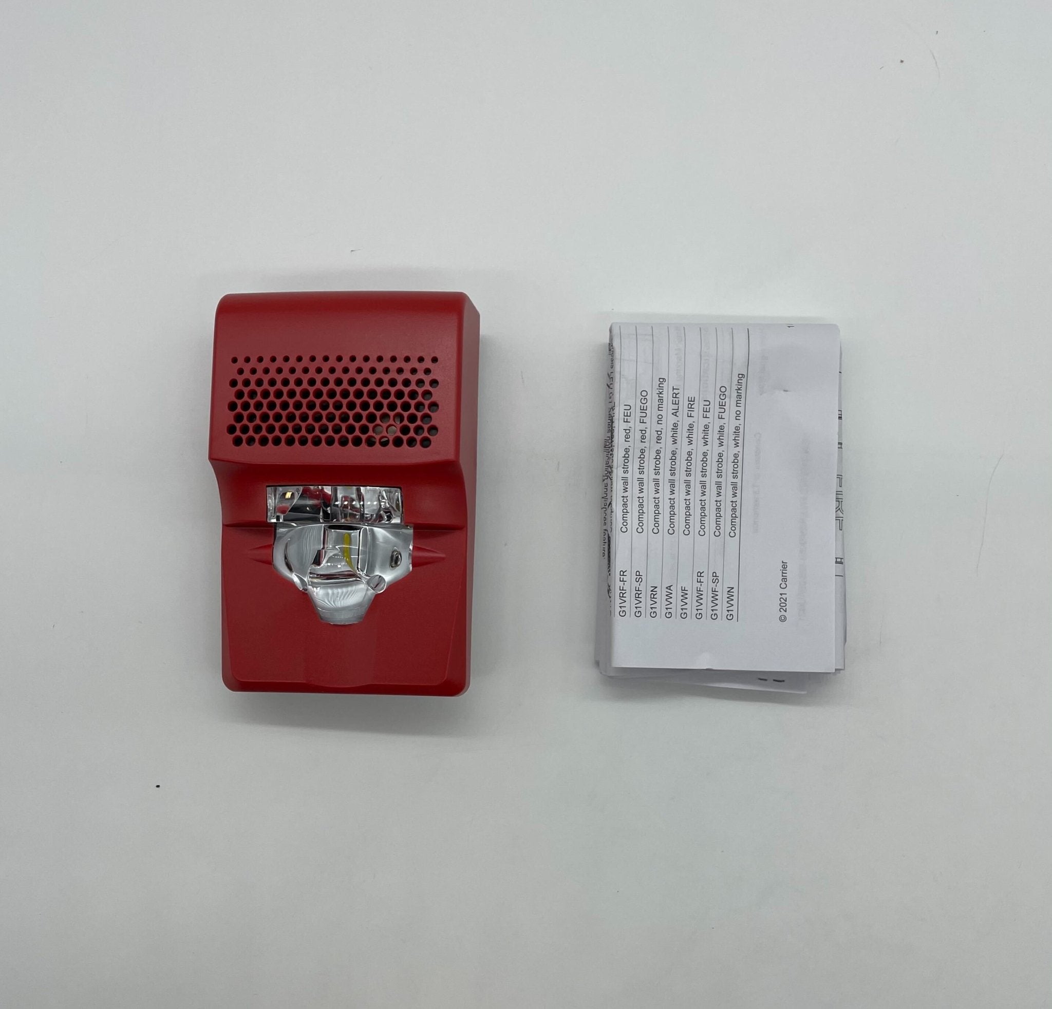 Edwards G1AVRN horn strobe alarm device with red warning light and speaker, mounted on wall for fire safety alert.