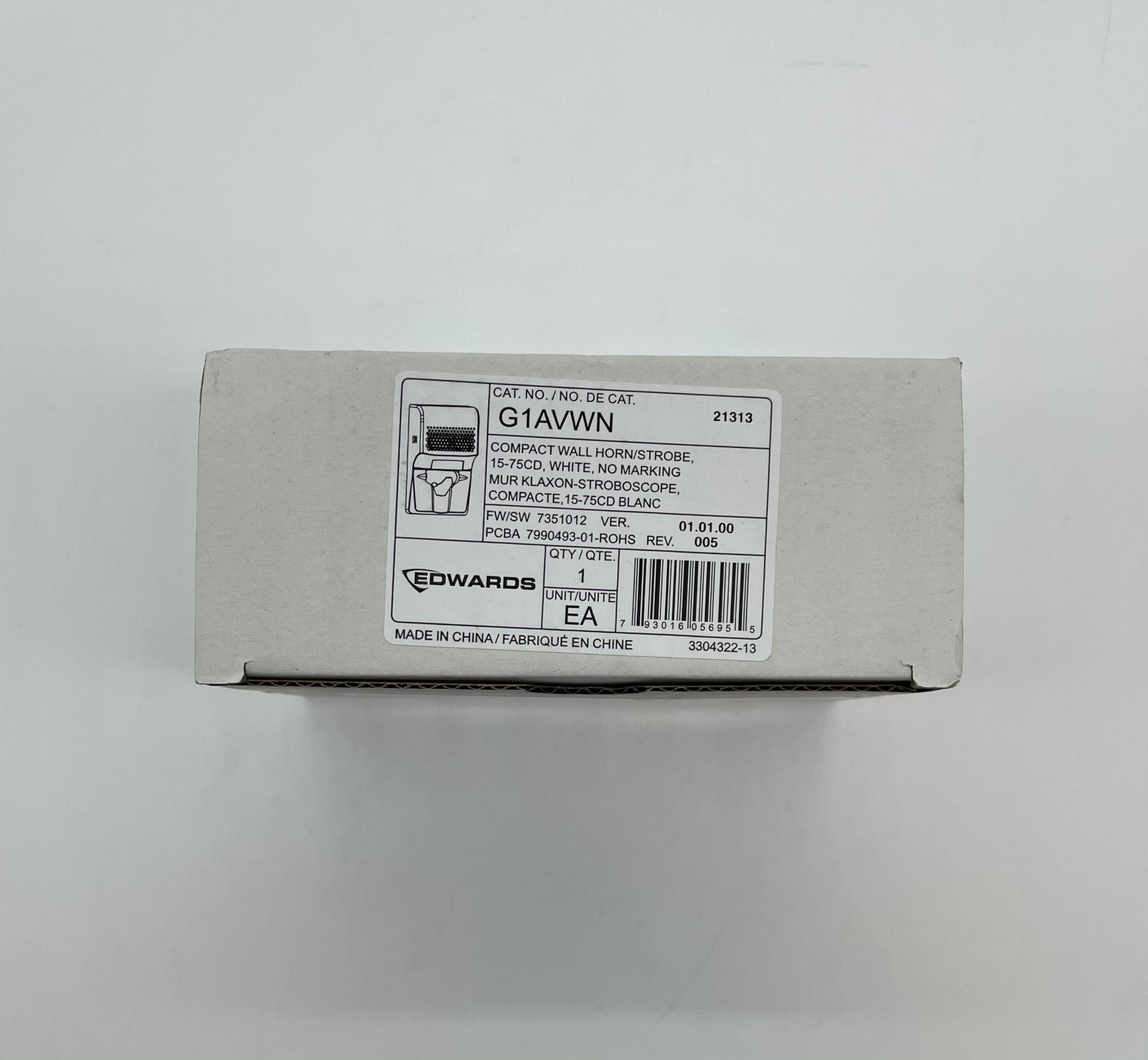Edwards G1AVWN horn strobe alarm in white with flashing light and loud siren, mounted on wall for emergency alert.