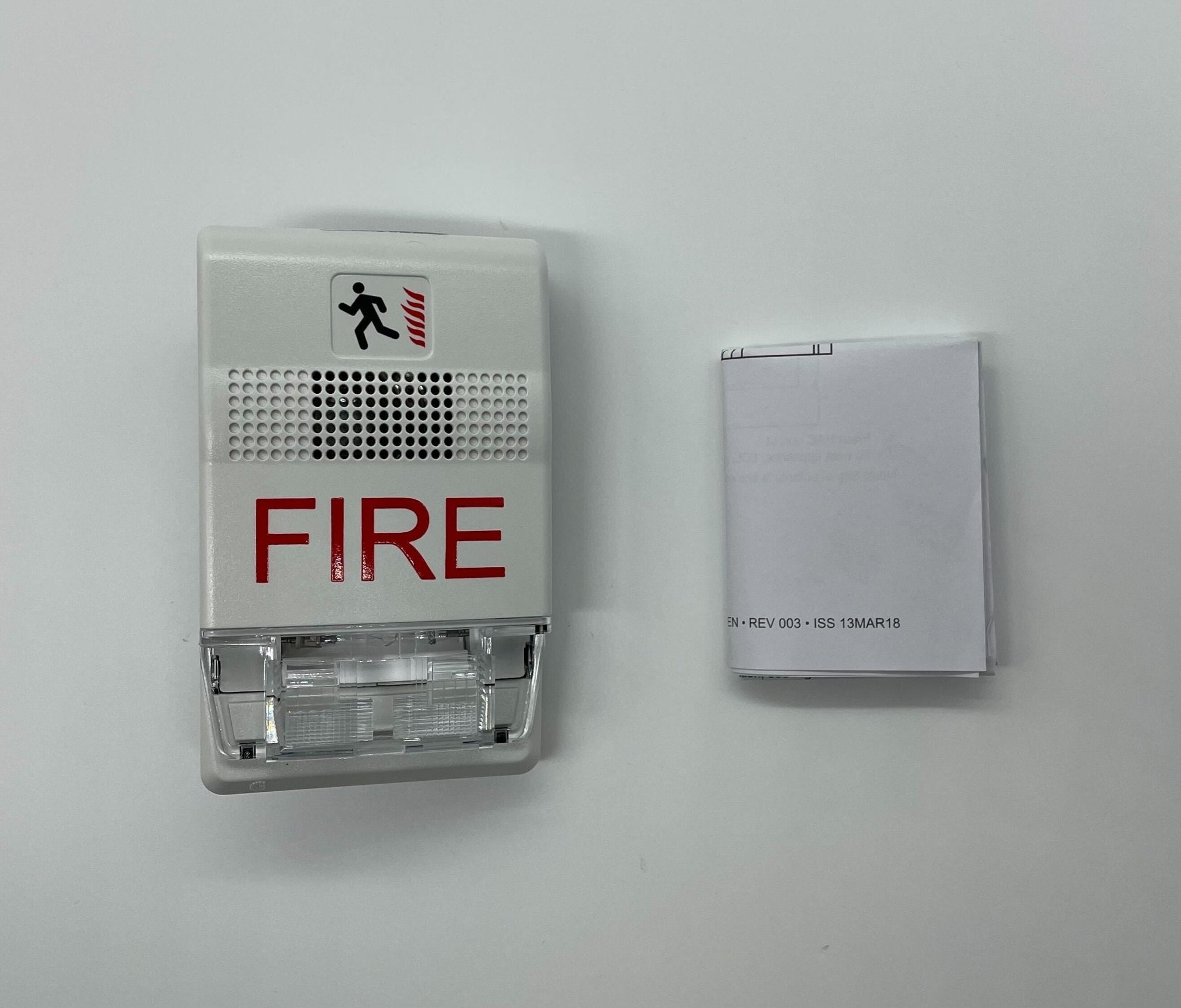 Edwards G1F-CVM strobe light mounted on industrial equipment, showcasing its compact design and durable construction.