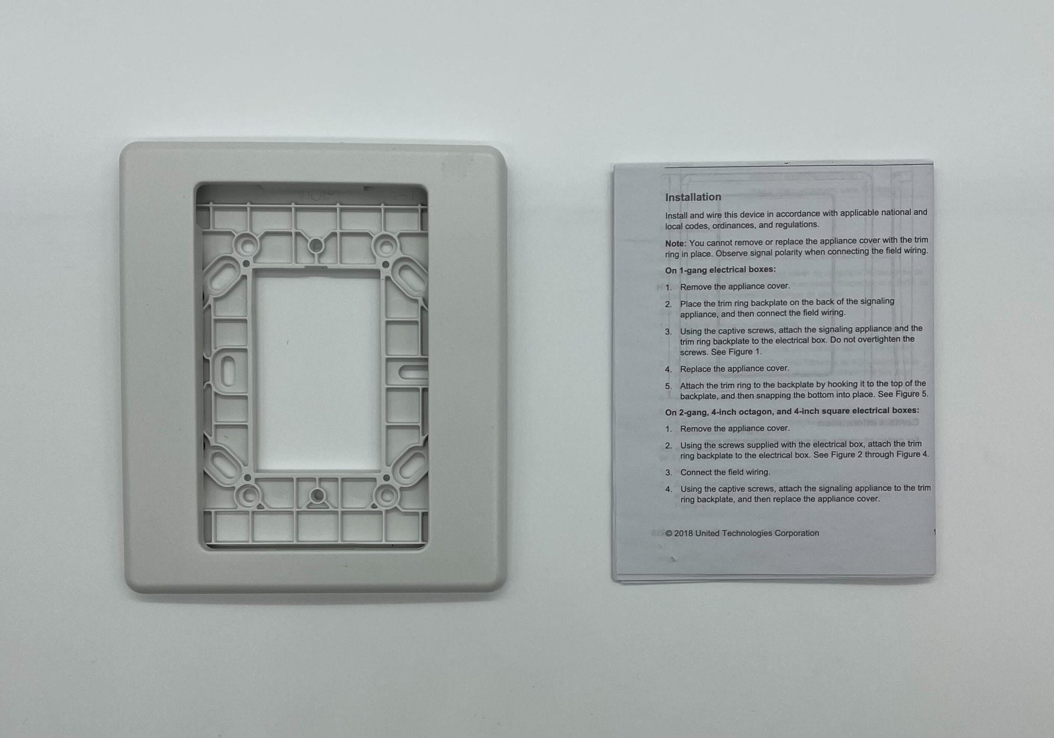 Edwards G1TW fire alarm with smoke and heat sensors, mounted on a ceiling for building safety detection.
