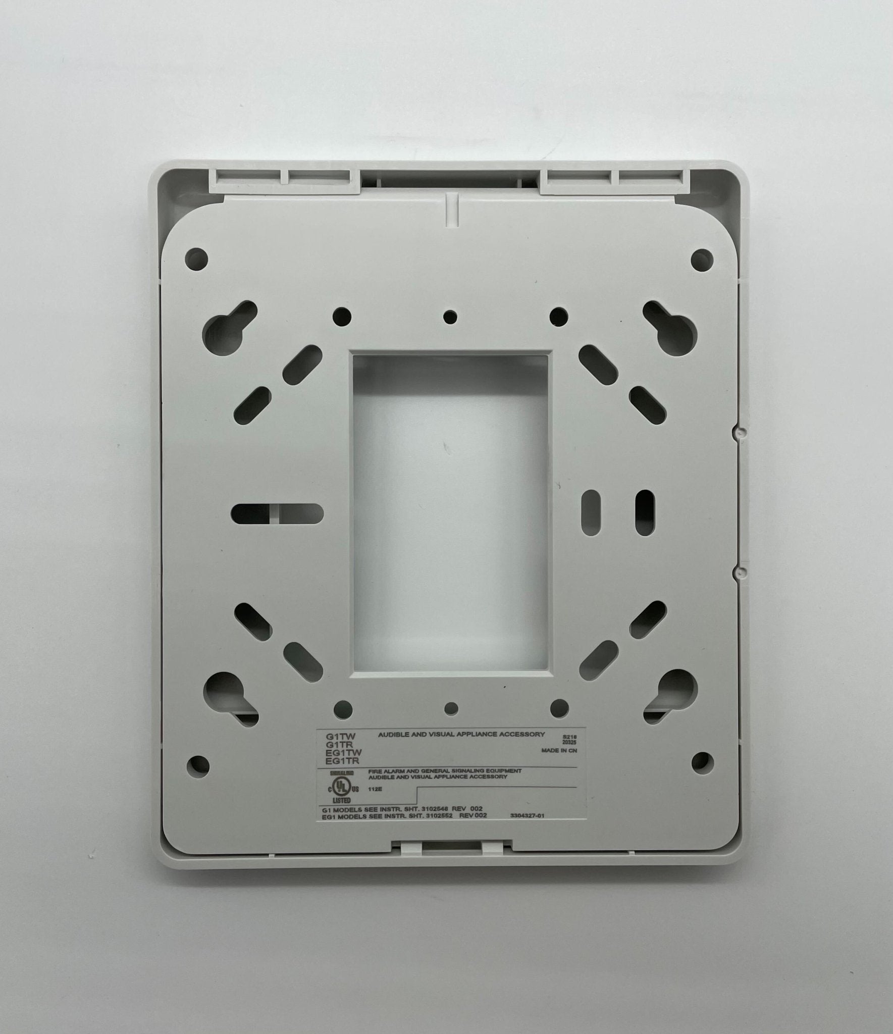 Edwards G1TW fire alarm with smoke detector and alarm sounder, mounted on ceiling for fire safety detection.