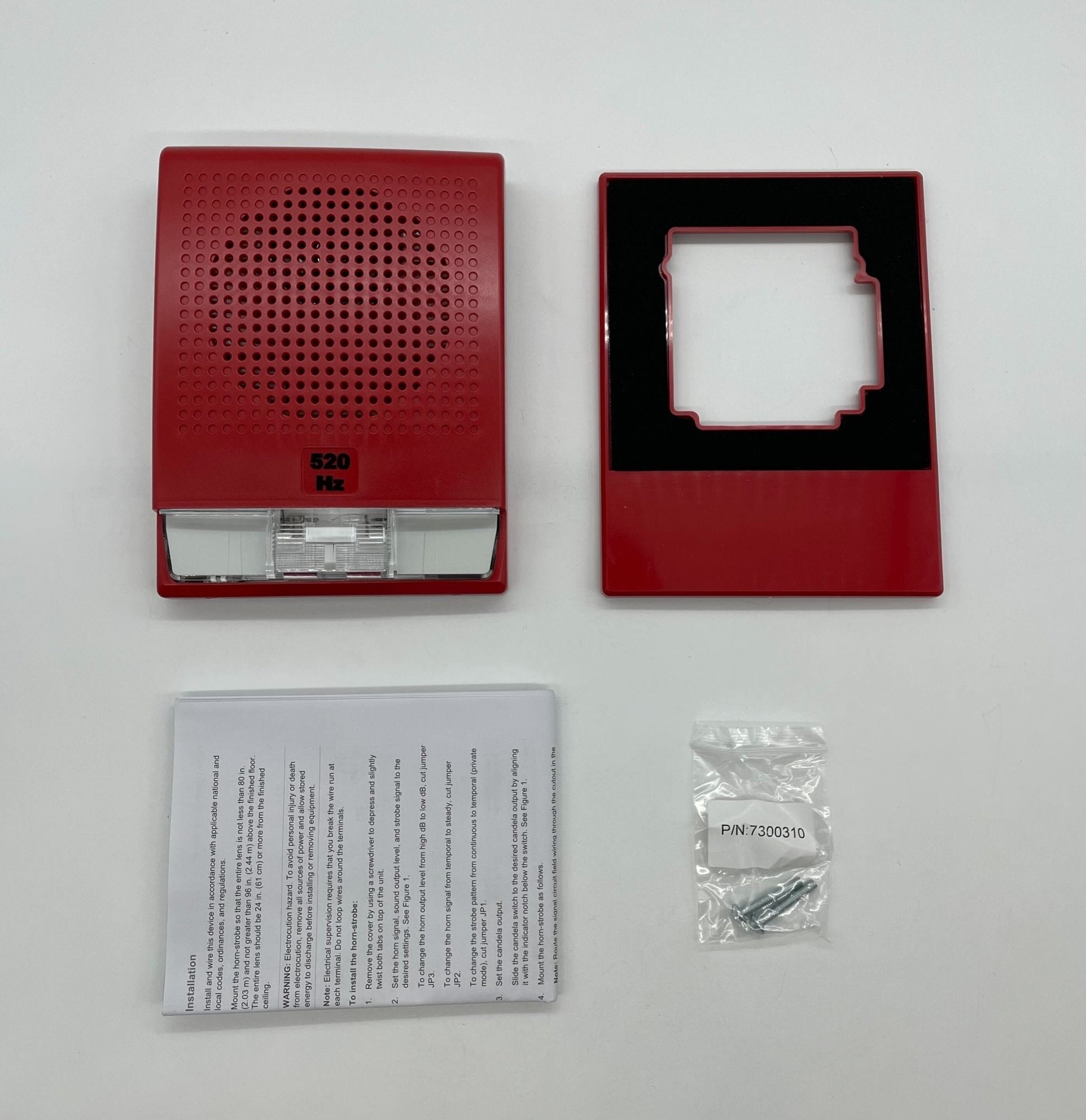 Edwards G4LFRF-HVM horn strobe alarm device mounted on wall, white Edwards G4LFRF-HVM horn strobe for emergency alert systems