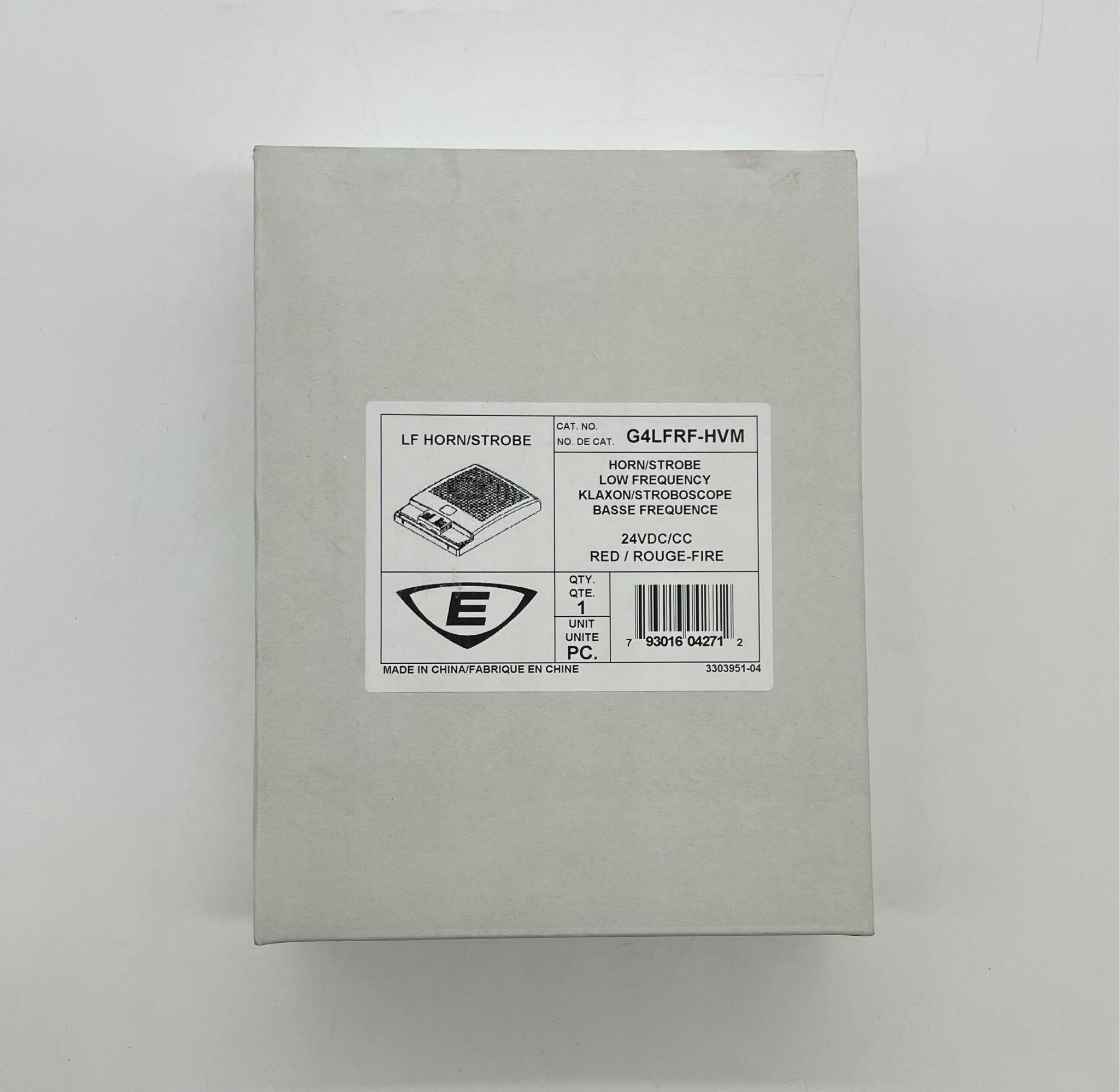 Edwards G4LFRF-HVM horn strobe alarm device mounted on wall with visible mounting hardware and wiring.