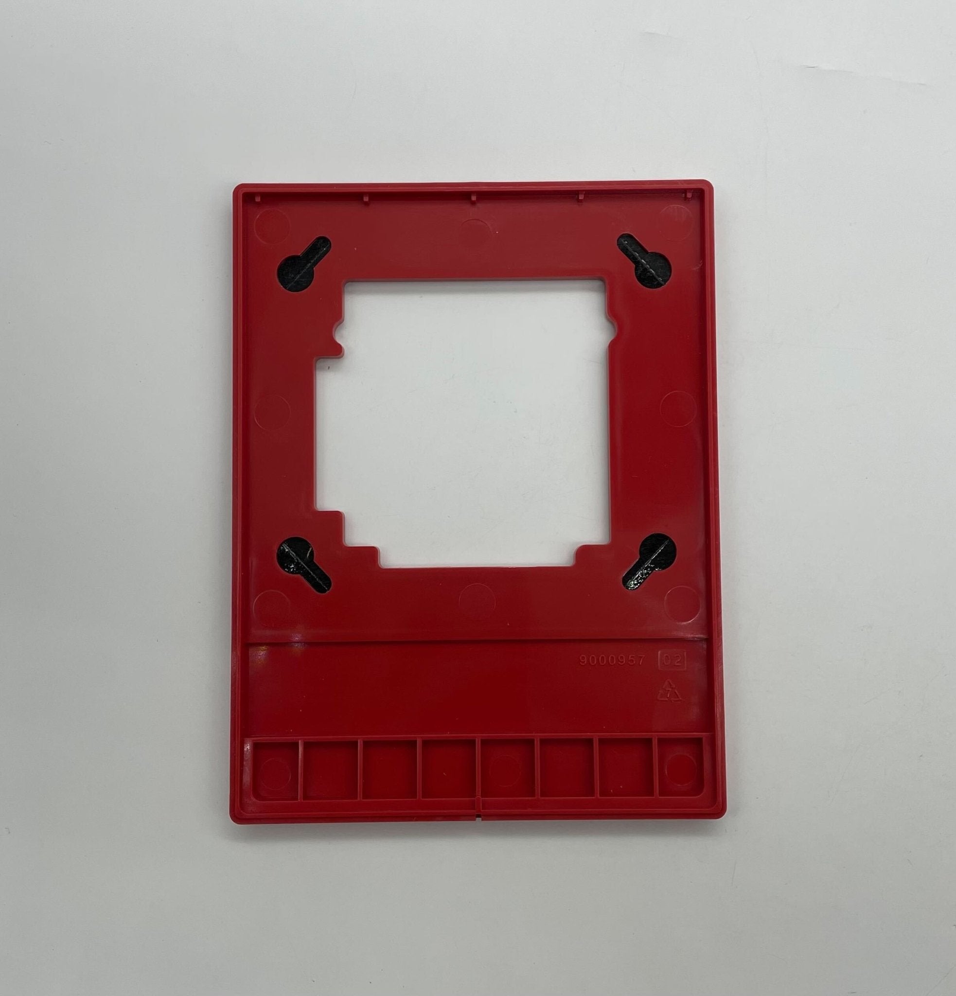 Edwards G4LFRF-HVM horn strobe alarm device mounted on wall, yellow housing with speaker and strobe light for fire safety.