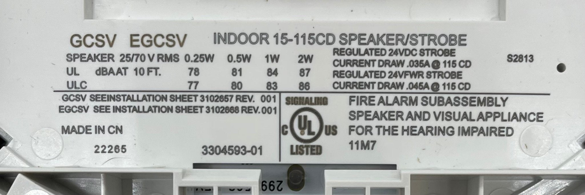 Edwards GCSVWF speaker strobe alarm device mounted on wall, with clear lens and mounting hardware, for fire alarm systems.