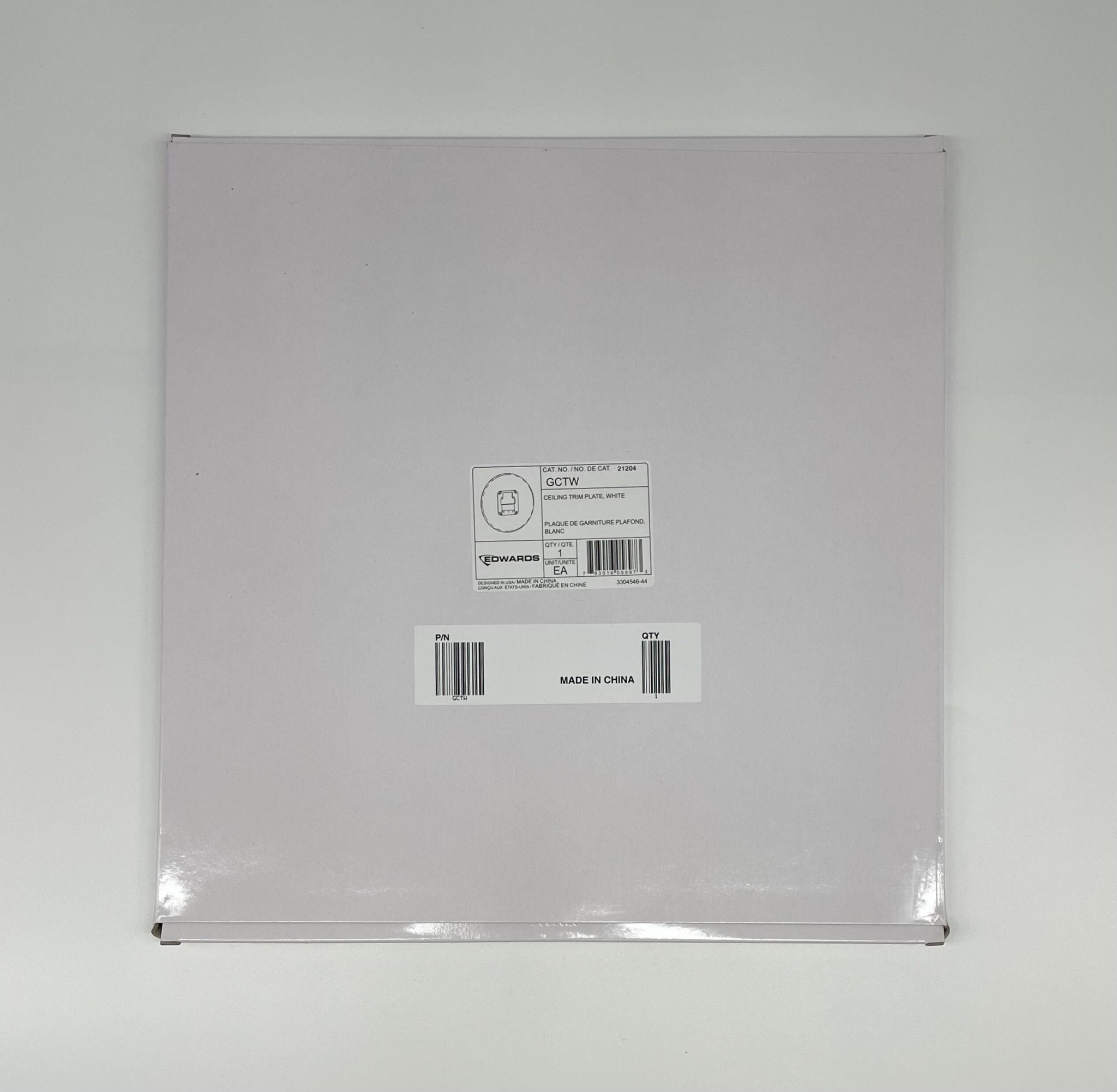 Edwards GCTW fire alarm with digital display and test button, mounted on wall for fire safety detection.