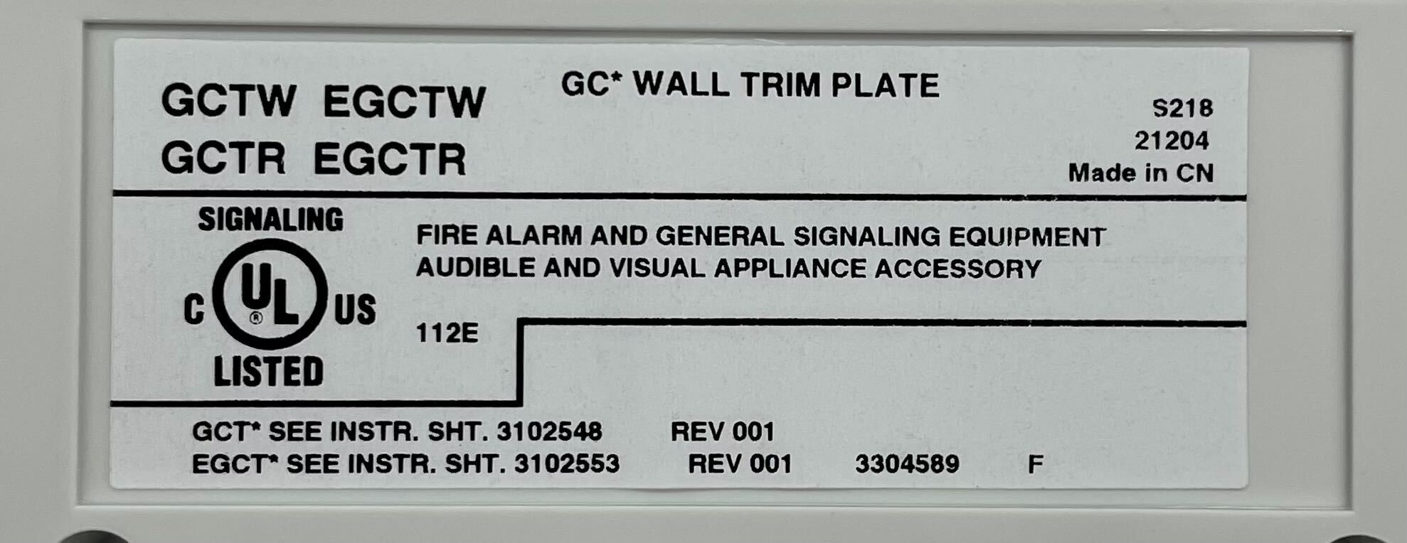 Edwards GCTW fire alarm by Edwards, mounted on wall, featuring digital display and alarm components for safety detection.