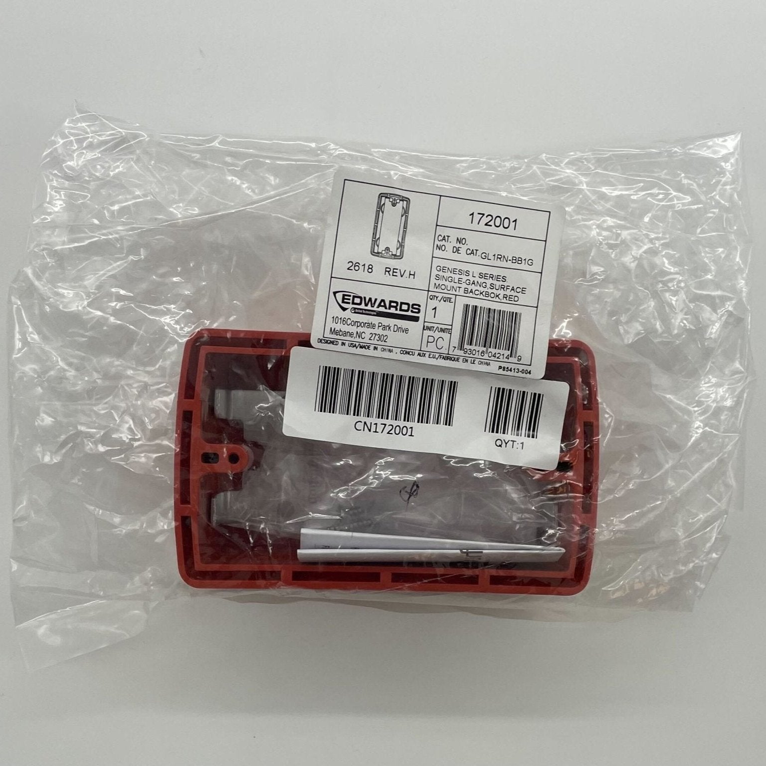 Edwards GL1RN-BB1G backbox mounted on a wall, metal enclosure for fire alarm system wiring, branded Edwards.