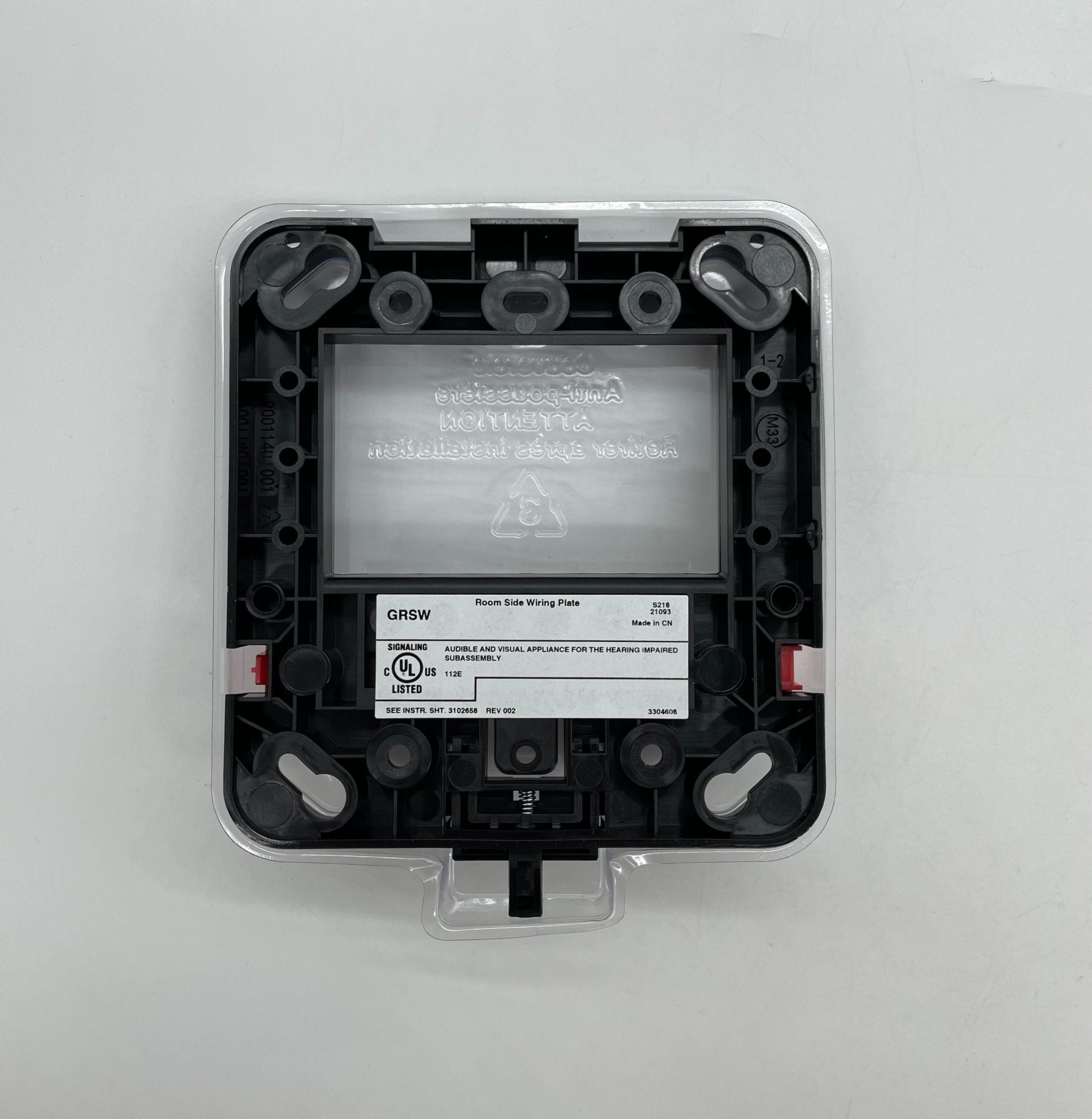 Edwards GRSW-10 fire alarm with digital display and black casing, mounted on a wall for safety monitoring.