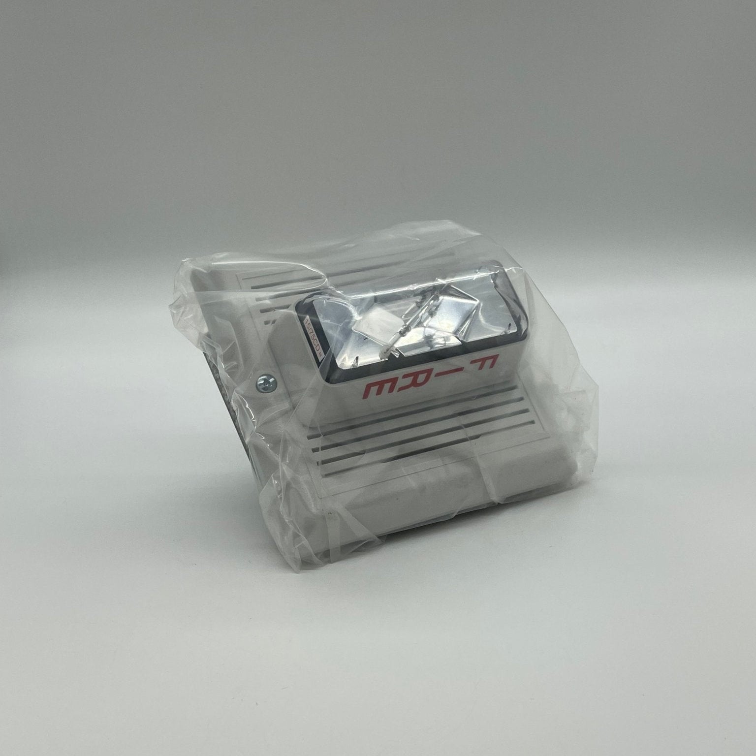Edwards 757-7A-TW horn strobe alarm device with a white plastic cover, designed for fire safety and emergency warning systems.