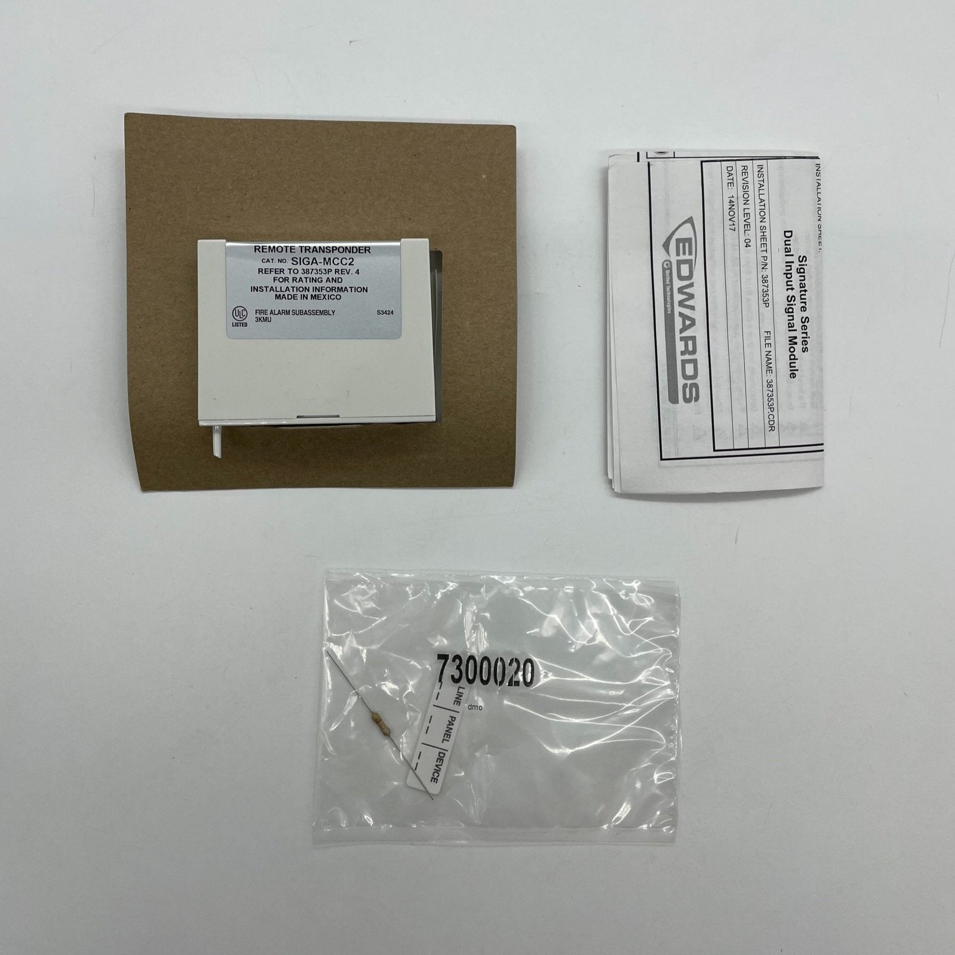 Edwards SIGA-MCC2 dual input signal module showing input terminals and wiring connections on a white background
