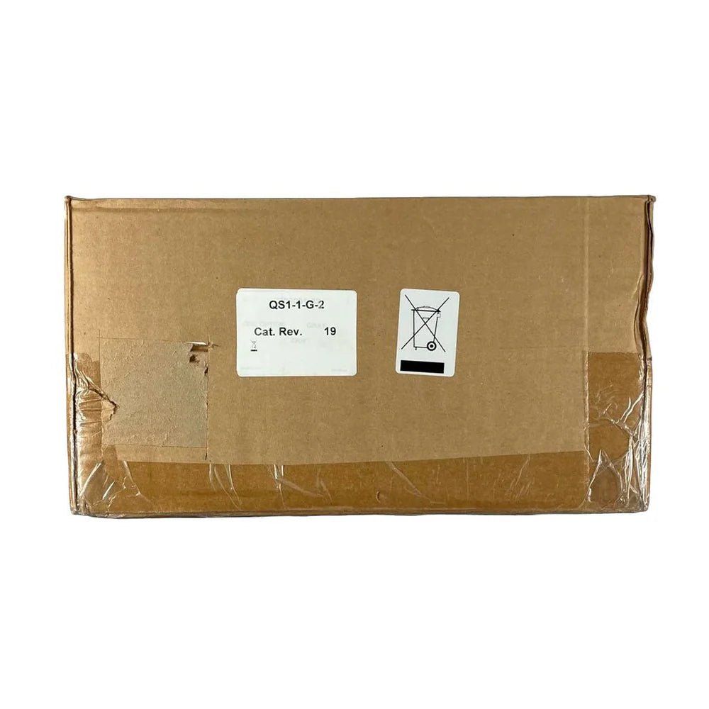 Edwards QS1-1-G-2 fire alarm with LED indicator and test button, mounted on wall for fire safety detection.