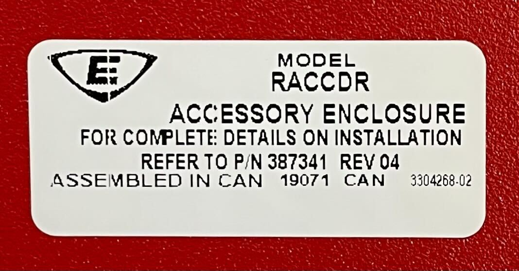 Edwards RACCDR fire alarm controller with Jem Systems Canada branding, mounted on a wall with indicator lights and control buttons.