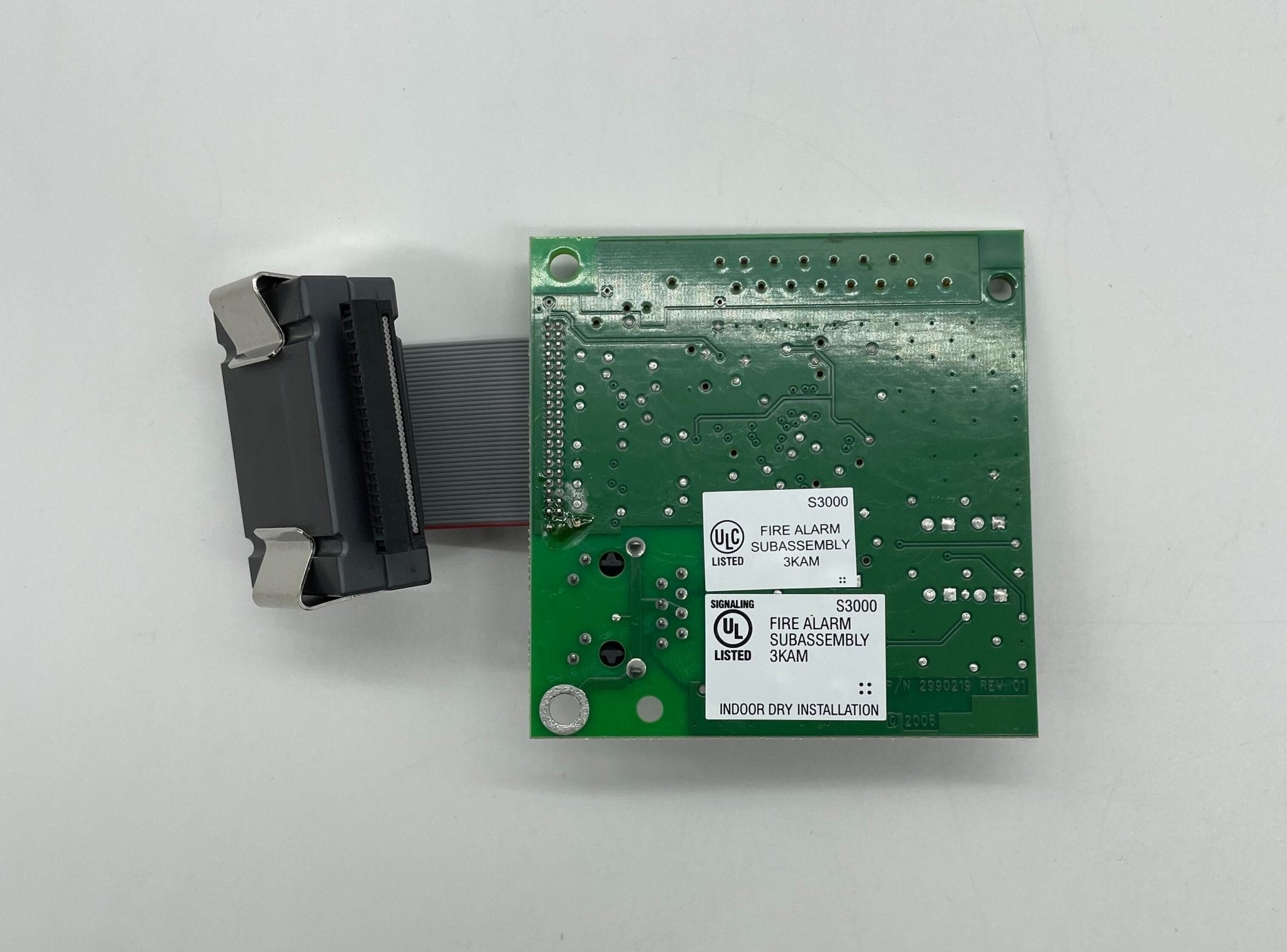 Edwards SA-ETH network card installed in a computer, showcasing Ethernet port and card components for networking.