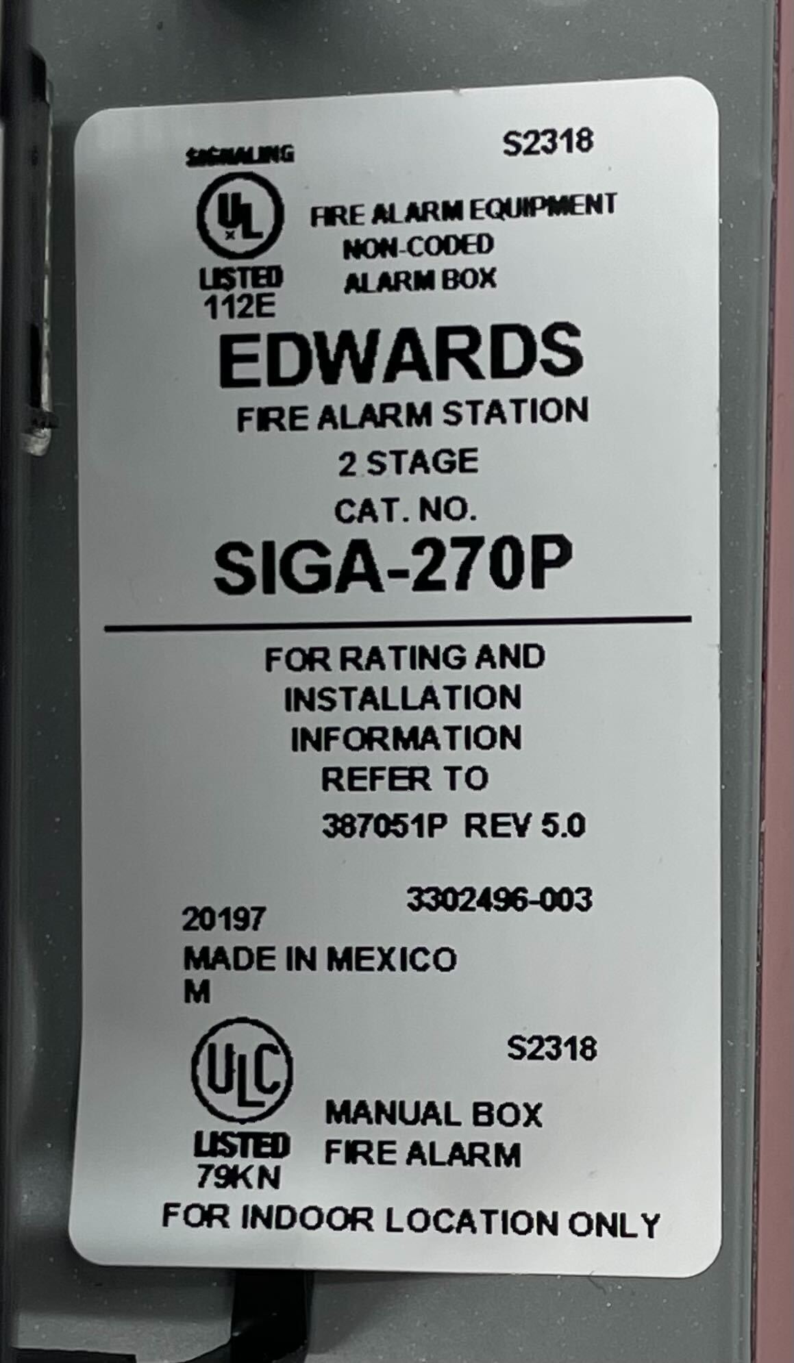 Edwards SIGA-270P safety valve with pressure gauge for industrial applications, mounted on a metal panel.