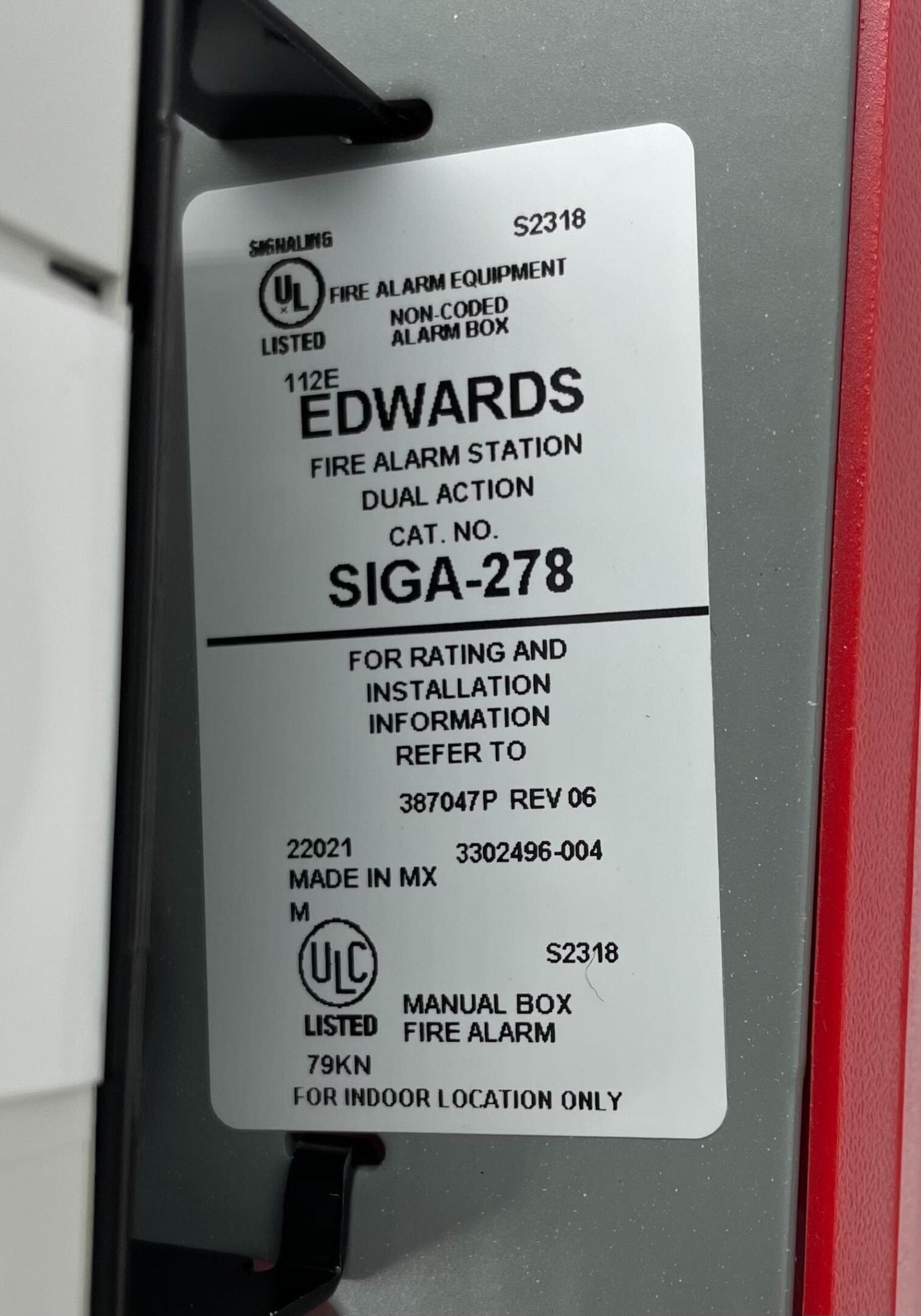Edwards SIGA-278 pull station for emergency alarm systems, mounted on wall with clear labeling and safety features.