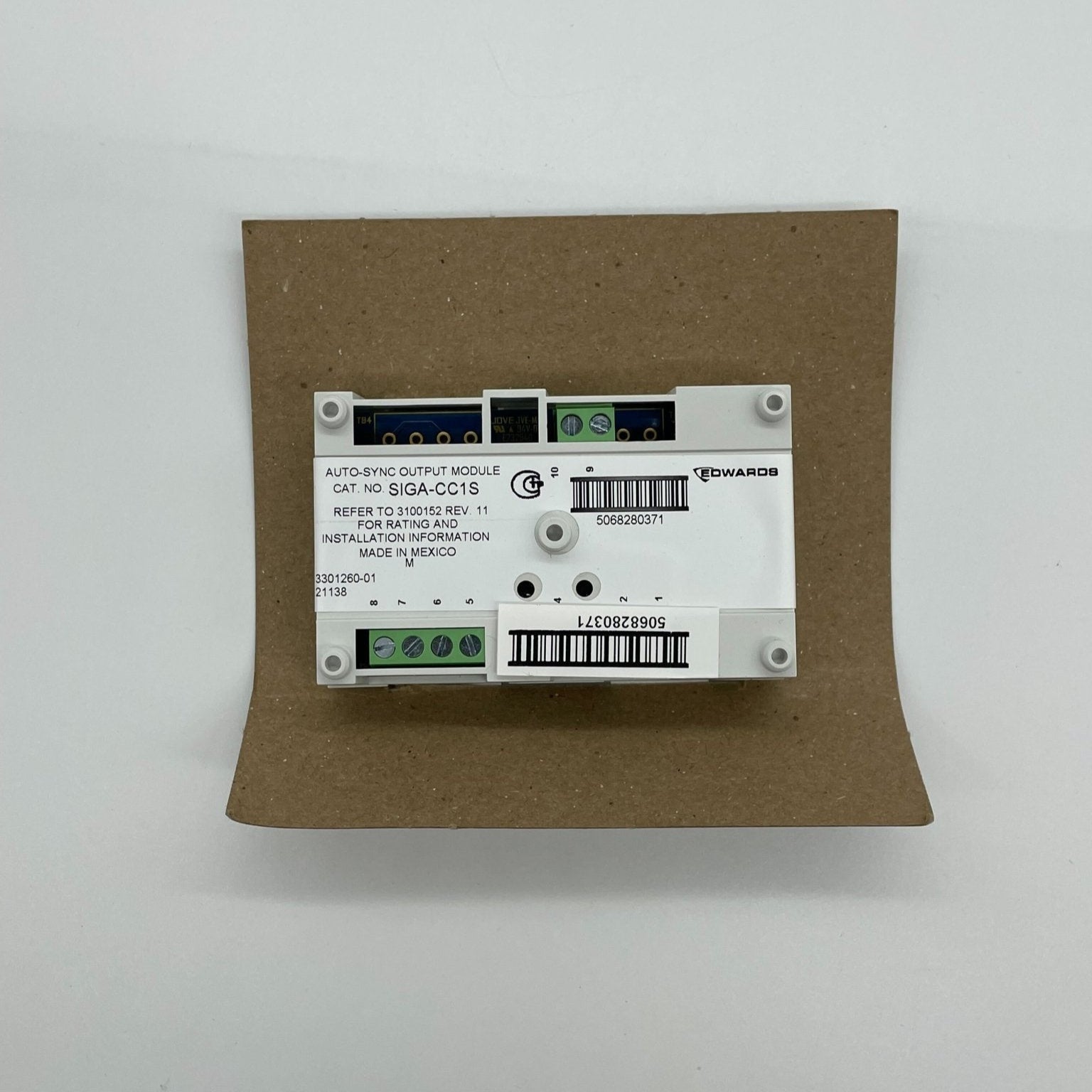 Edwards SIGA-CC1S synchronization output module in a black and gray enclosure with indicator lights and connection ports.