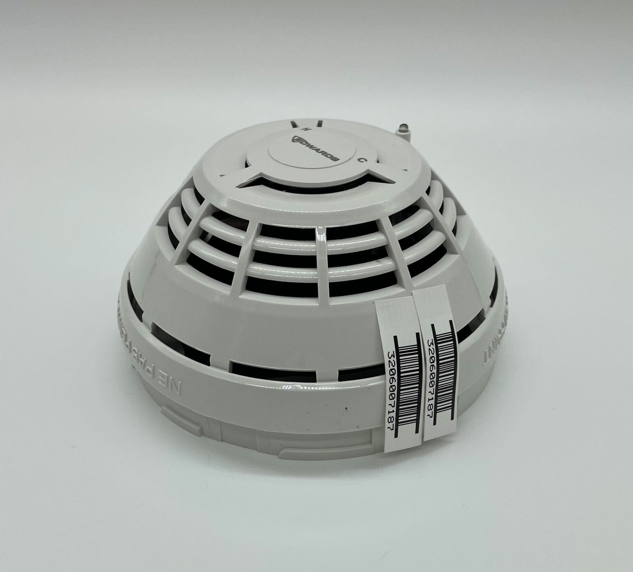 Edwards SIGA-HCD heat detector mounted on ceiling, designed for fire safety in commercial buildings