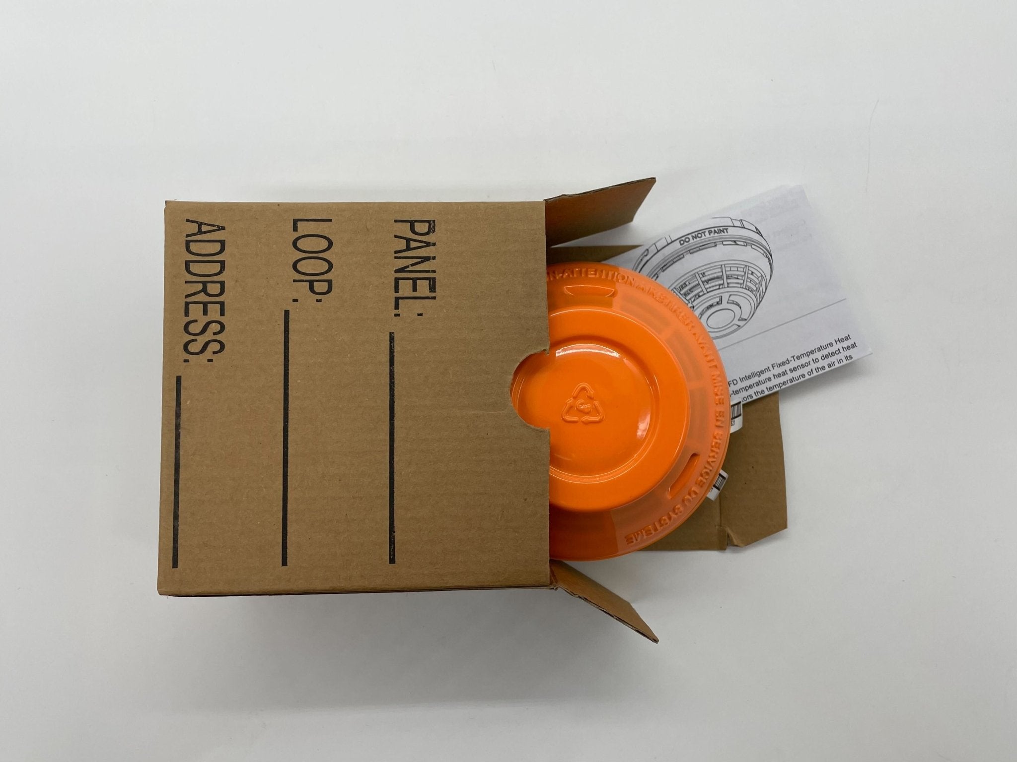 Edwards SIGA-HFD heat detector mounted on ceiling, used for fire safety in commercial buildings.