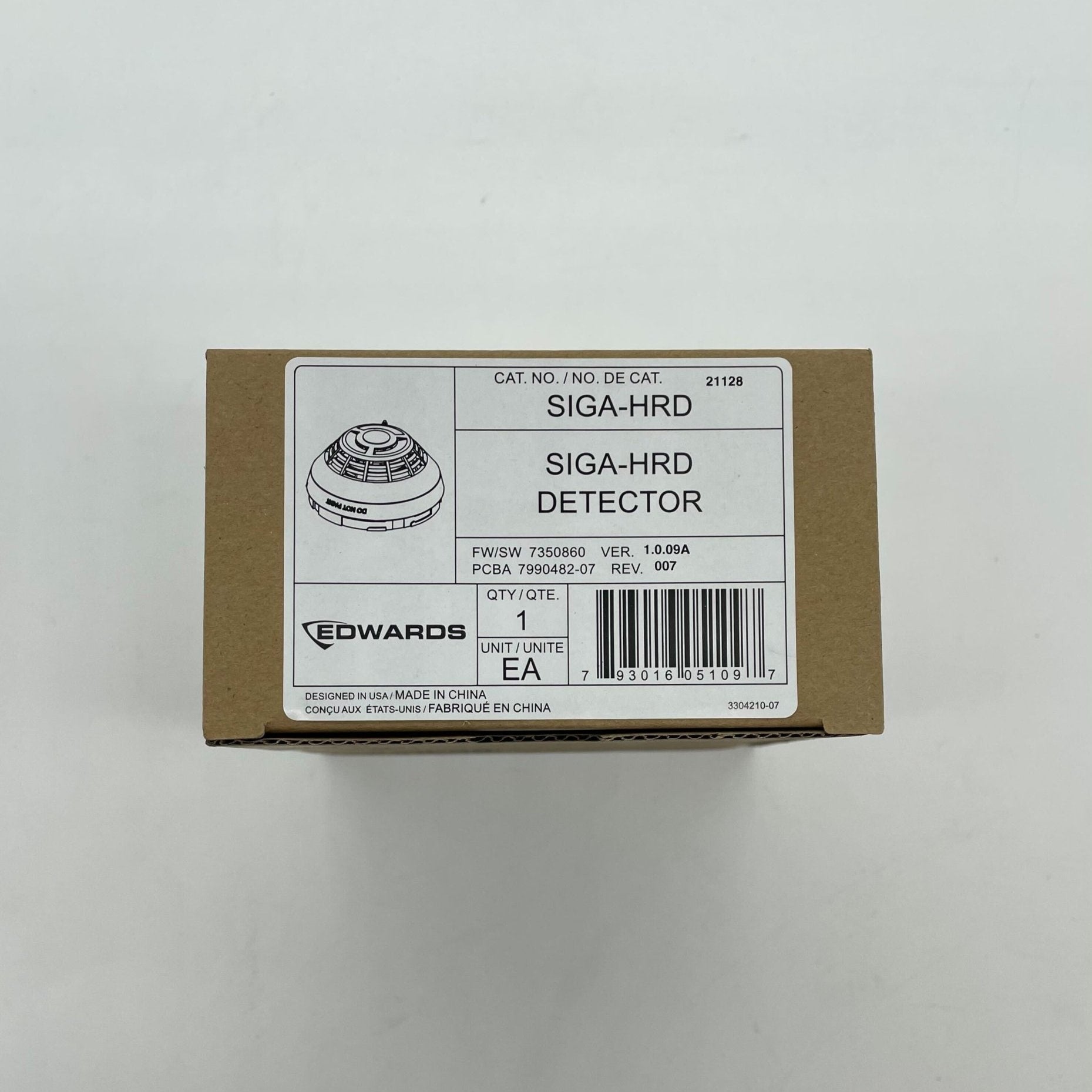 Edwards SIGA-HRD Intelligent Heat Detector mounted on ceiling, designed for fire safety in commercial buildings.