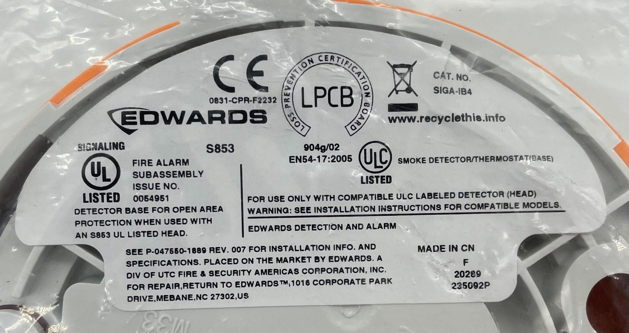 Edwards SIGA-IB4 base shown in the image, a component used in vacuum systems by Edwards, with a sleek metallic finish.