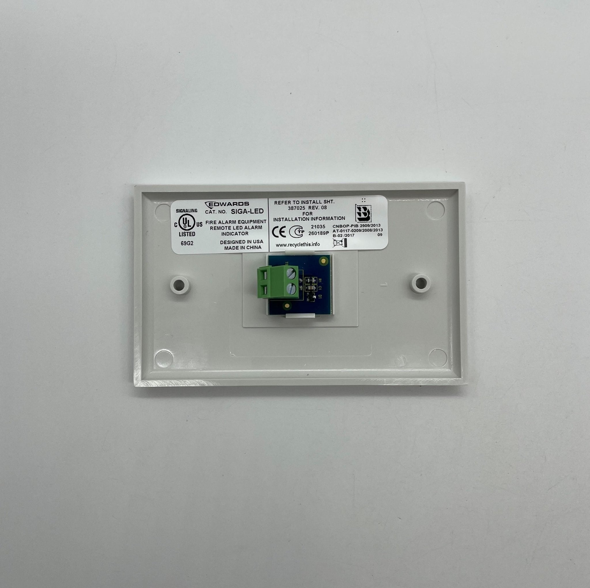 Edwards SIGA-LED fire alarm with LED indicator light, mounted on a ceiling, designed for fire safety and alerting.