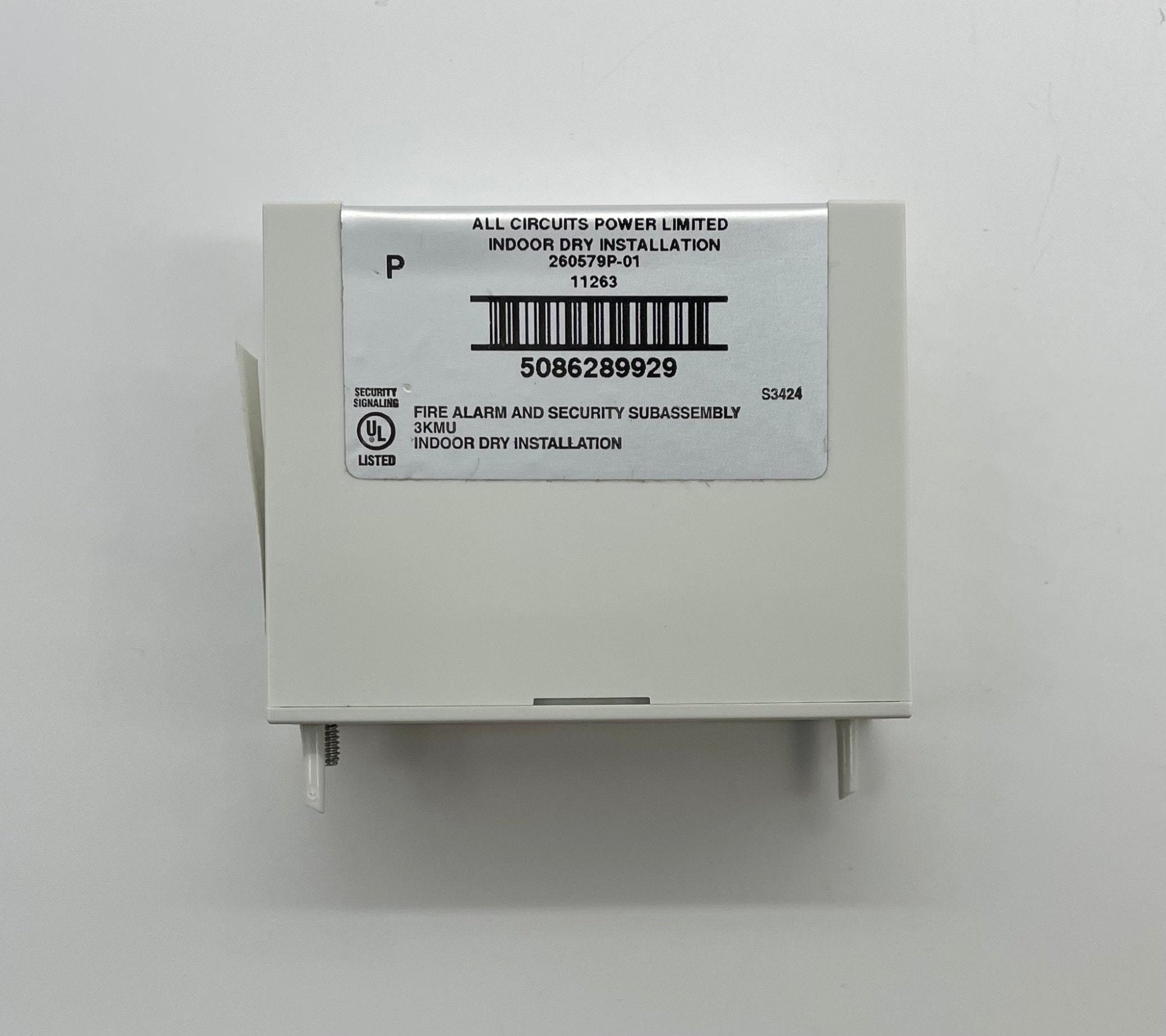 Edwards SIGA-MCC1 module installed in a control panel, with electronic components and wiring visible inside a metal enclosure.