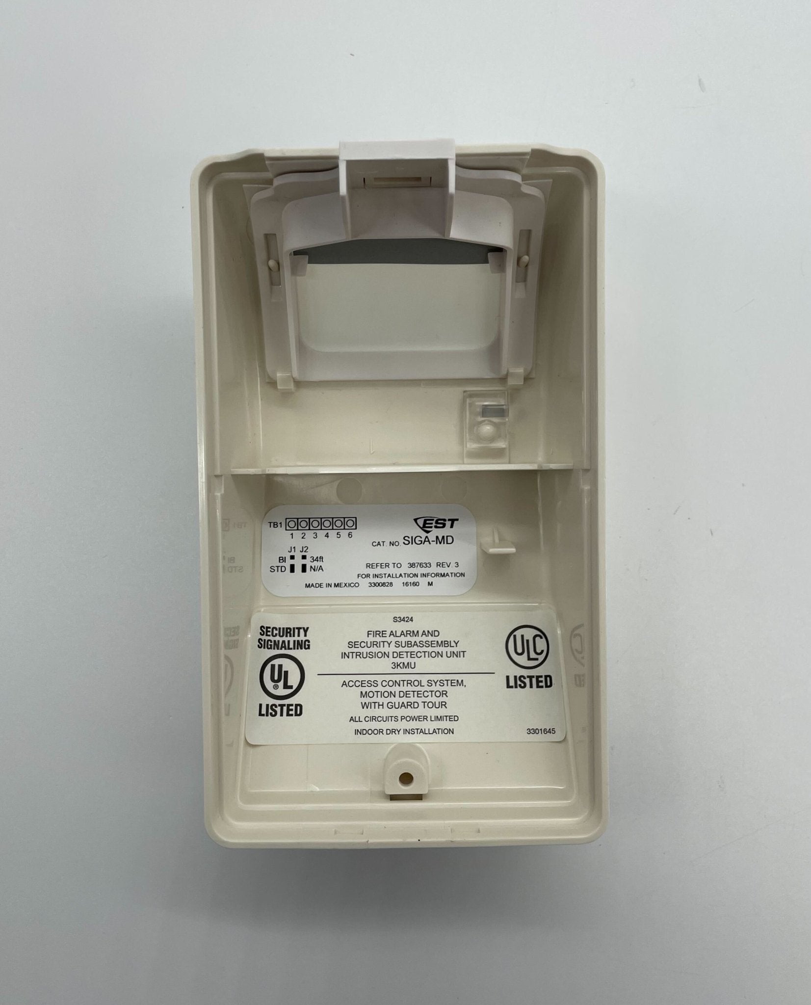 Edwards SIGA-MD fire alarm detector mounted on ceiling, part of Edwards fire alarm system for safety and fire detection.