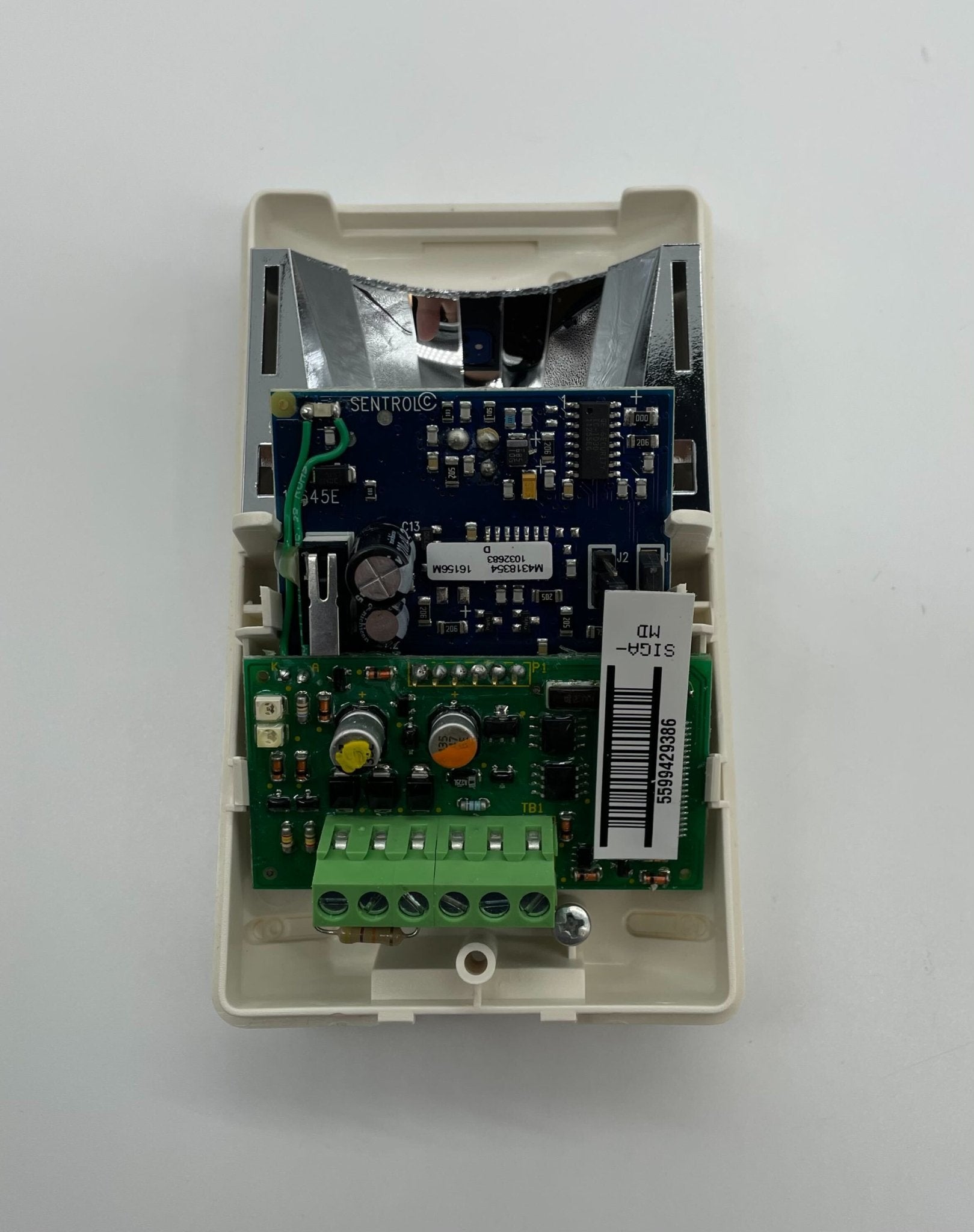 Edwards SIGA-MD fire alarm device mounted on wall, featuring a sleek design and indicator lights for safety alerts.