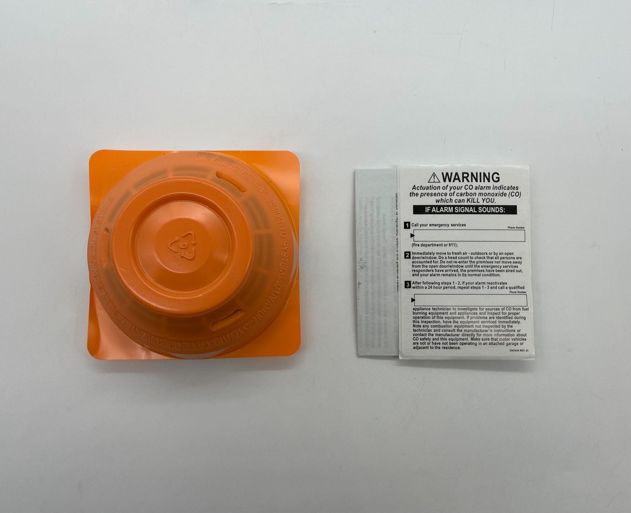 Edwards SIGA-PHCD heat detector mounted on ceiling, part of Edwards fire safety system, with electronic components visible.