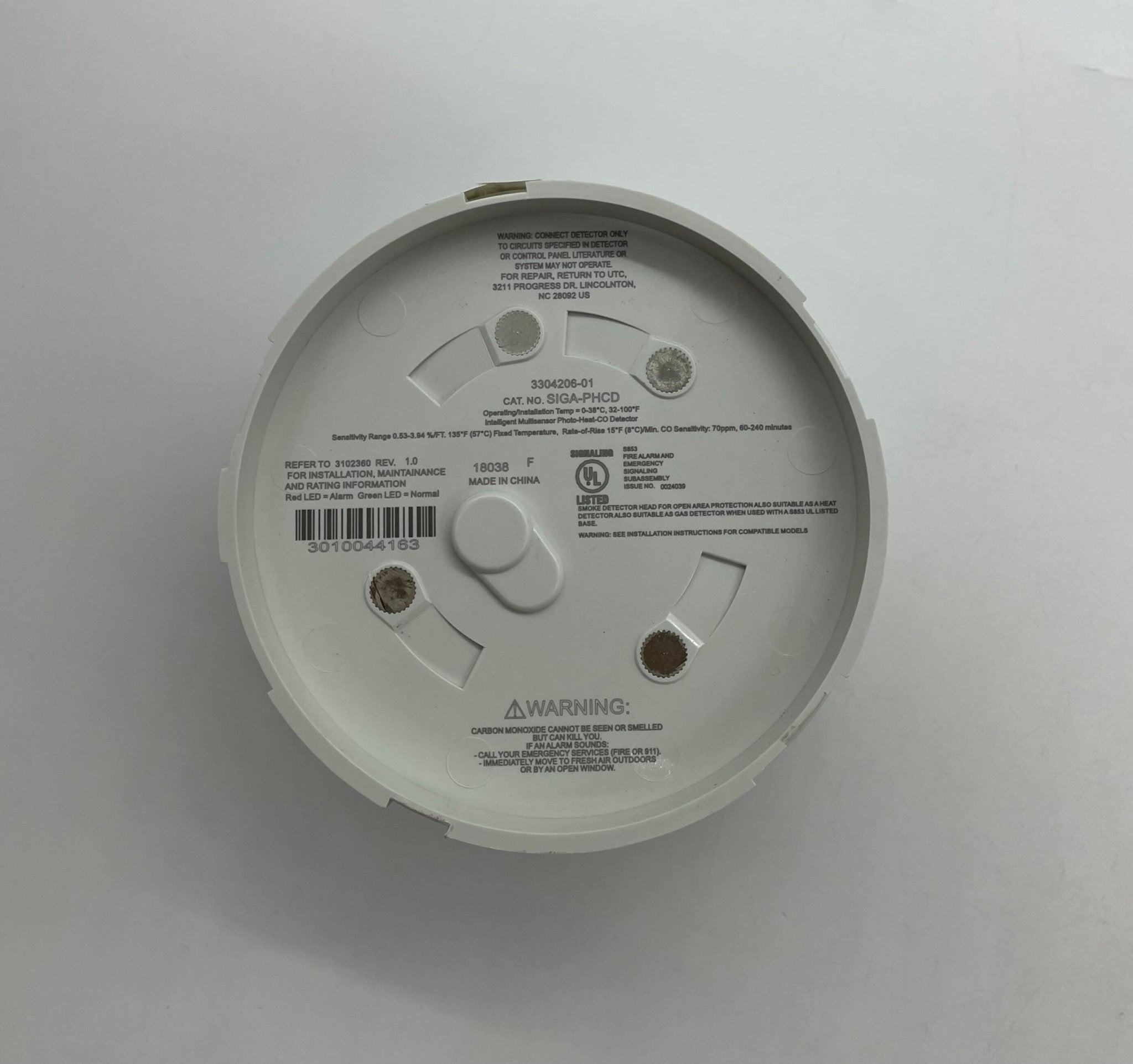 Edwards SIGA-PHCD heat detector mounted on ceiling, part of Edwards fire safety system for early smoke and heat detection