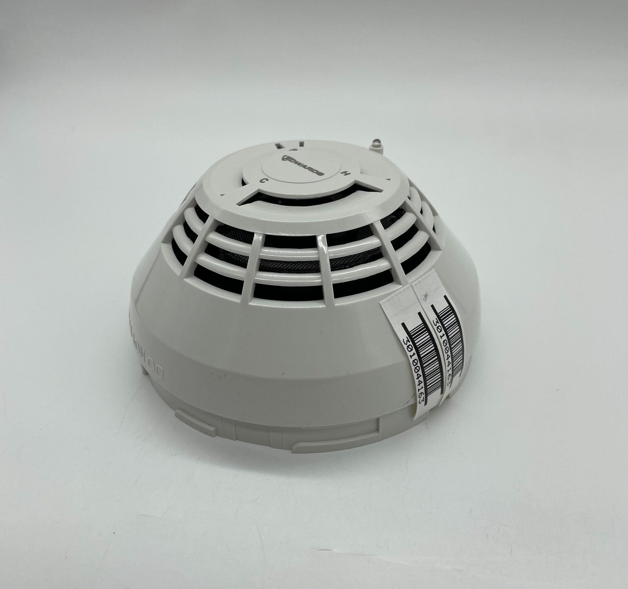 Edwards SIGA-PHCD heat detector mounted on ceiling, used for fire safety and early warning in building security systems.
