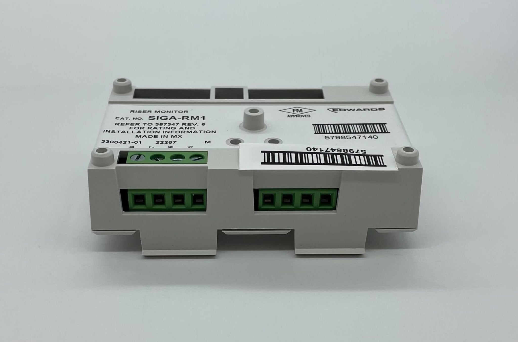Edwards SIGA-RM1 module for fire suppression systems, shown in a close-up with detailed components and wiring.