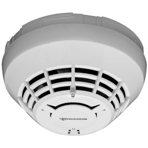 Edwards SIGA-OSD-IN smoke detector mounted on ceiling, black circular device with sensor and alarm components, for fire safety.