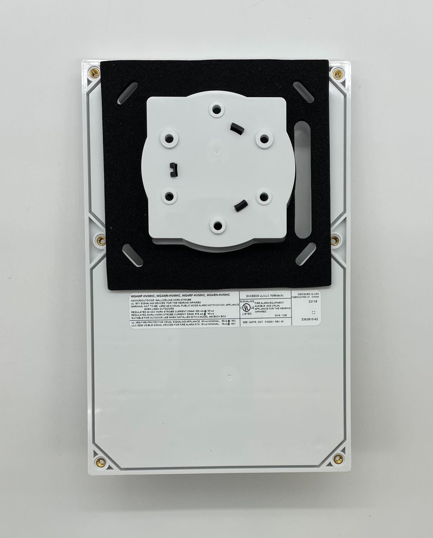 Edwards WG4RN-HVMHC horn strobe alarm with bright yellow housing, mounted on a wall, designed for fire and security alert systems.