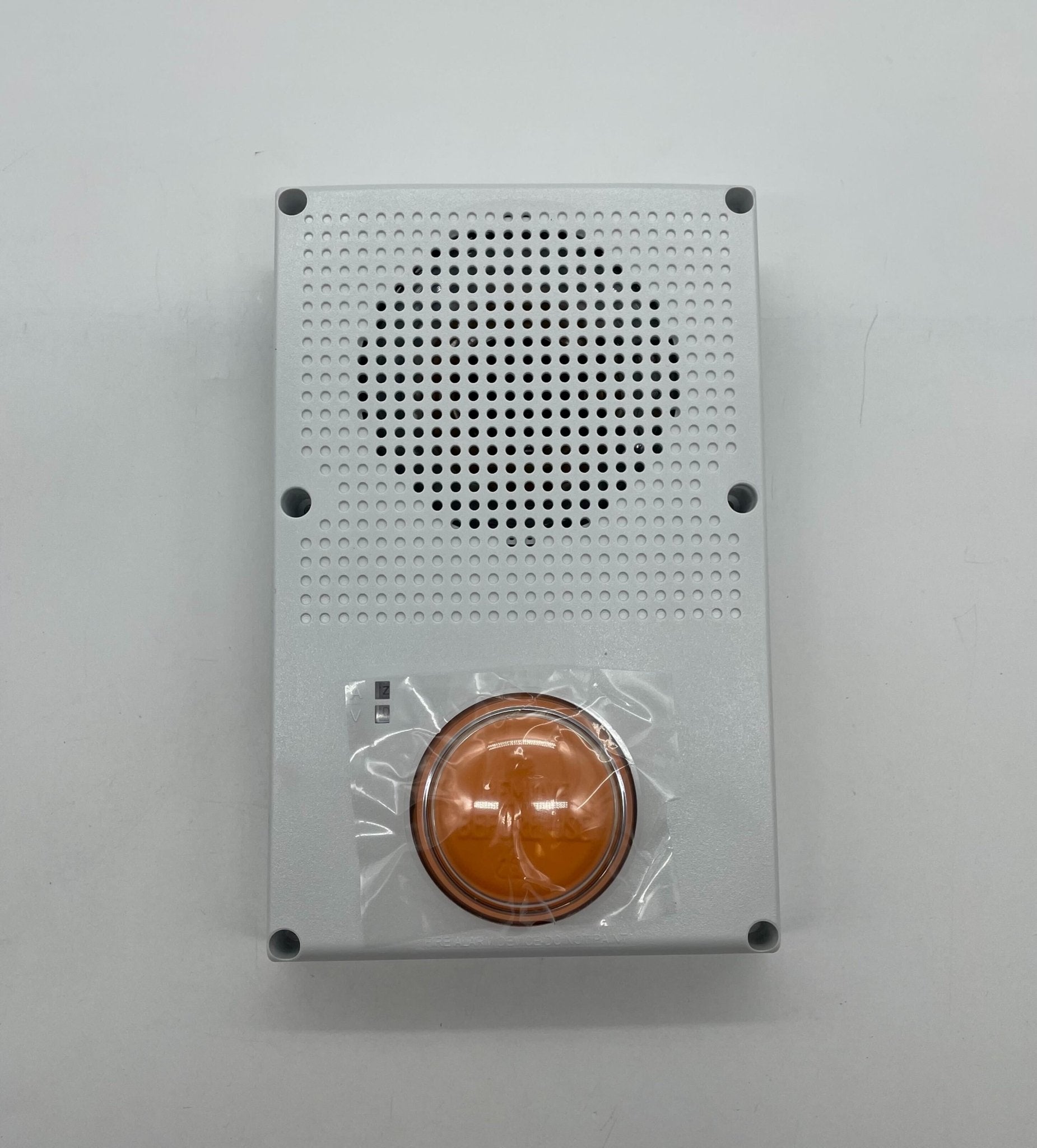 Edwards WG4WF-SVMHC speaker strobe alarm device with white housing and visible mounting hardware, designed for fire safety systems.