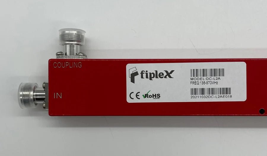 Fiplex by Honeywell BDA-DC6-L2 broadband distribution amplifier with multiple ports, used for signal amplification in communication systems.