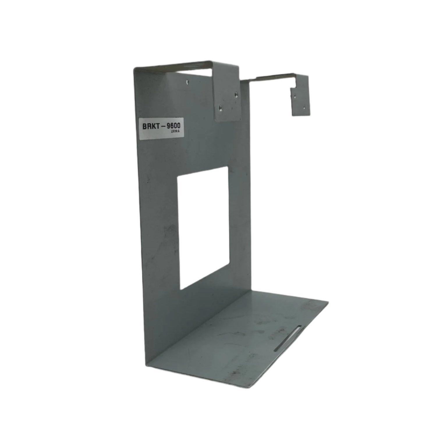 Fire-Lite BRKT-9600 fire alarm control panel bracket mounted on a wall, showing its sturdy design and installation features.