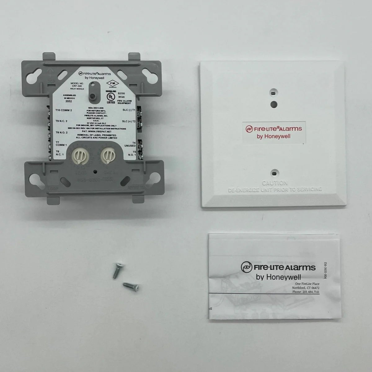 Firelite CRF-300 fire alarm control panel mounted on a wall with control buttons and display screen.