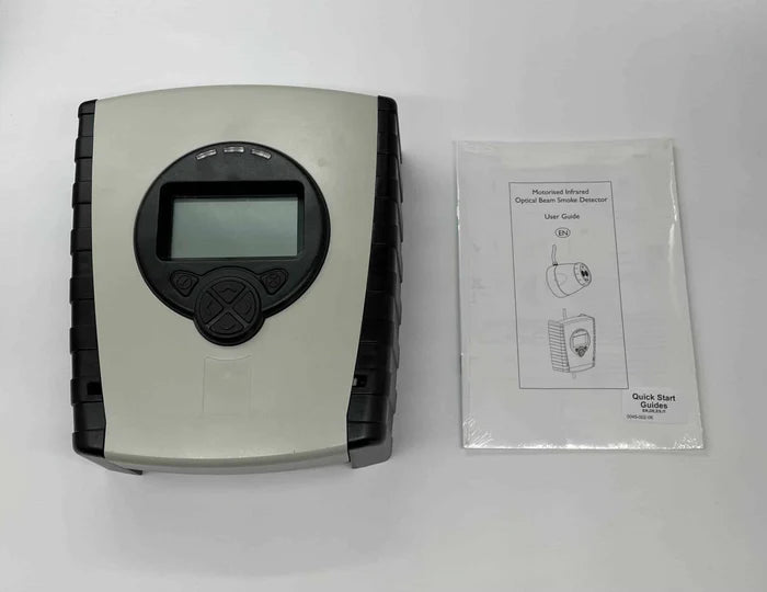 Fireray 5000-003 smoke detector sensor with white casing, mounted on a wall for fire detection in industrial or commercial settings.