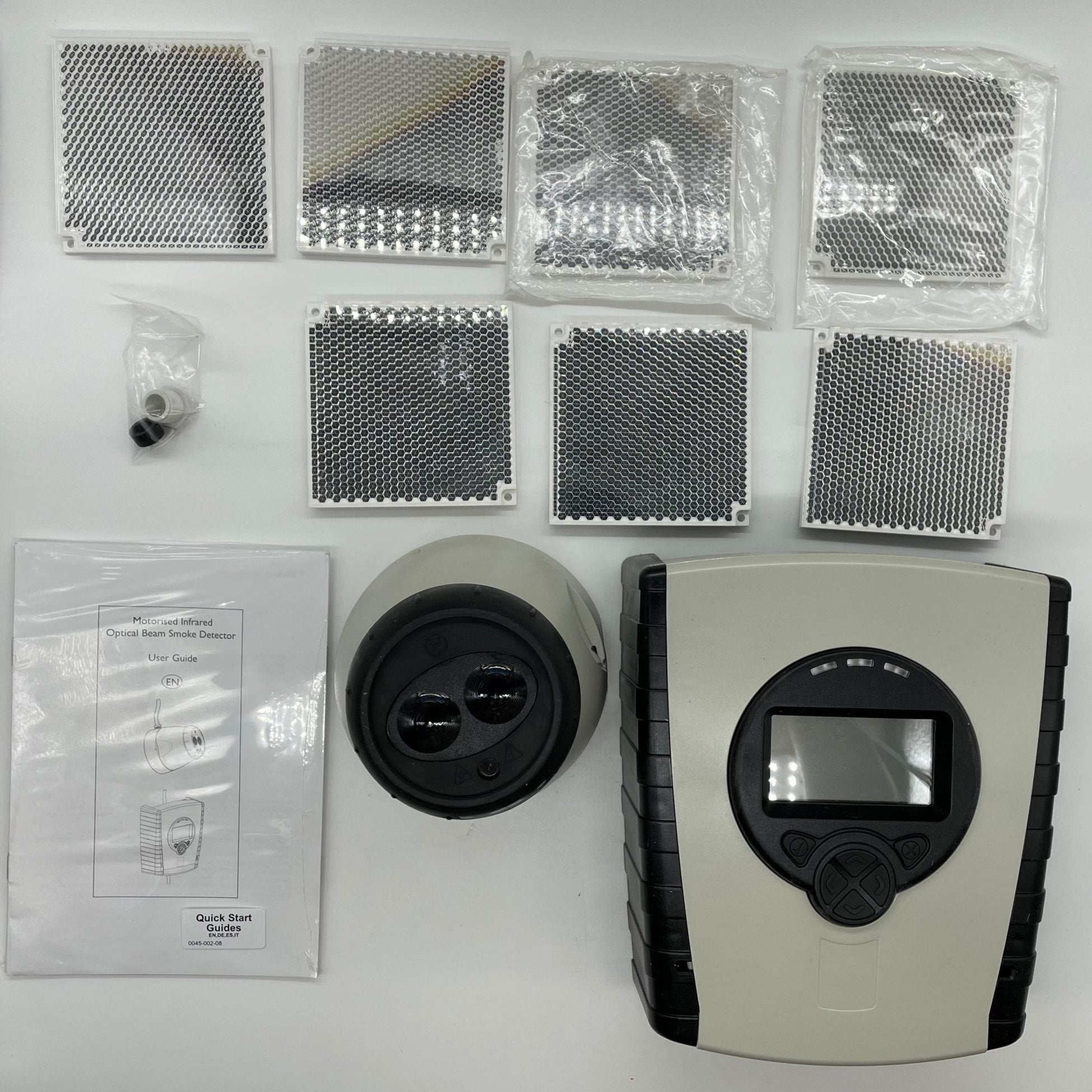 Fireray 5000-104 smoke and flame detector by Fireray, mounted on ceiling for fire detection and safety monitoring.