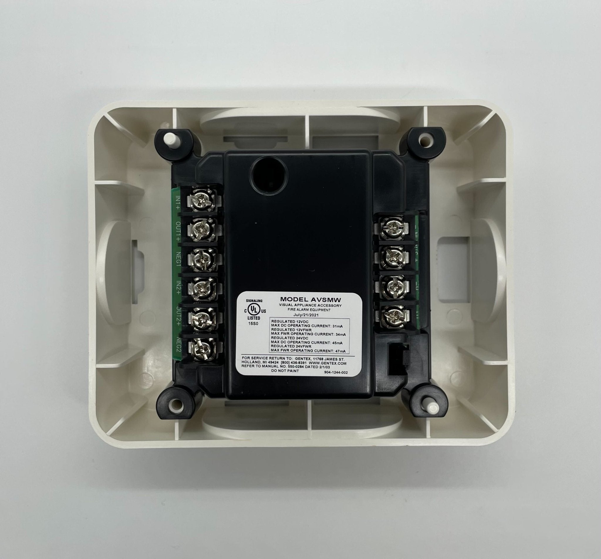 Gentex AVSM-W synchronization control module in white, featuring electronic components and wiring for vehicle lighting systems.