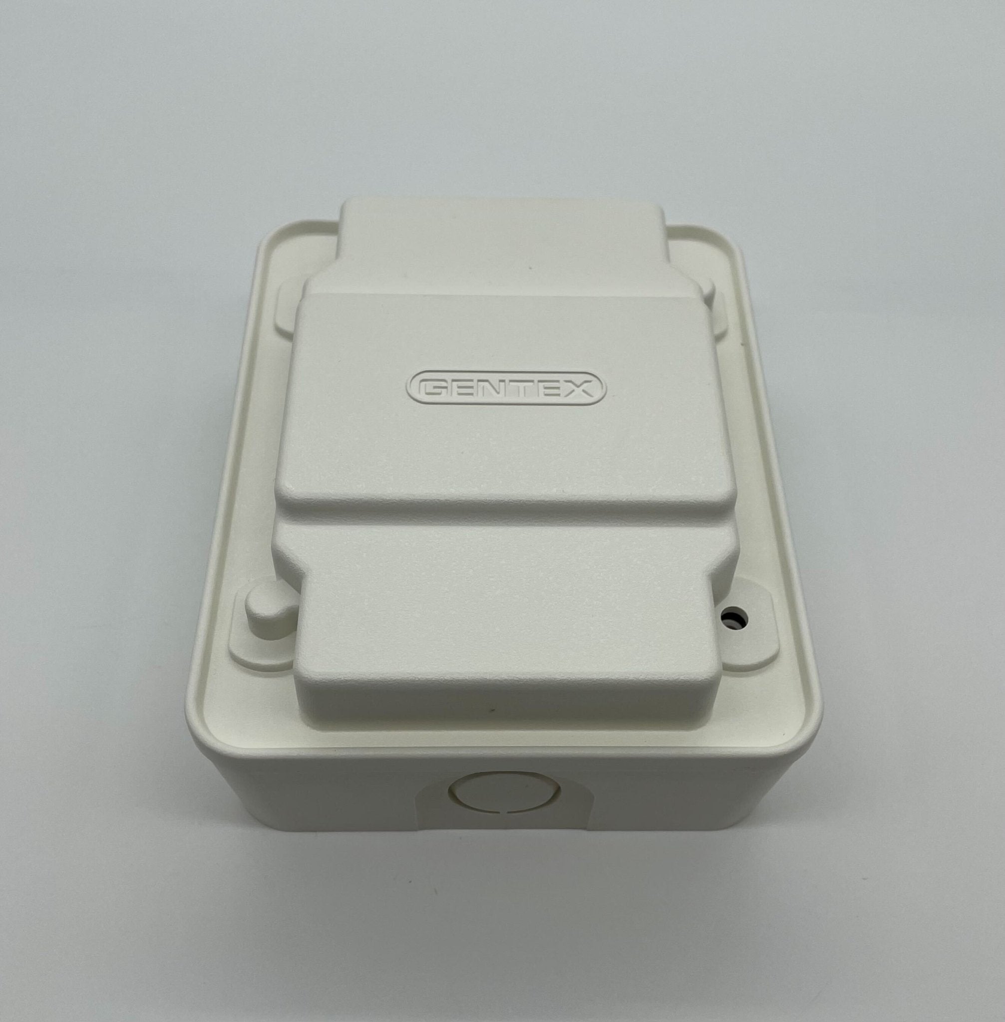 Gentex AVSM-W synchronization control module in white, designed for vehicle systems, shown on a clean background.